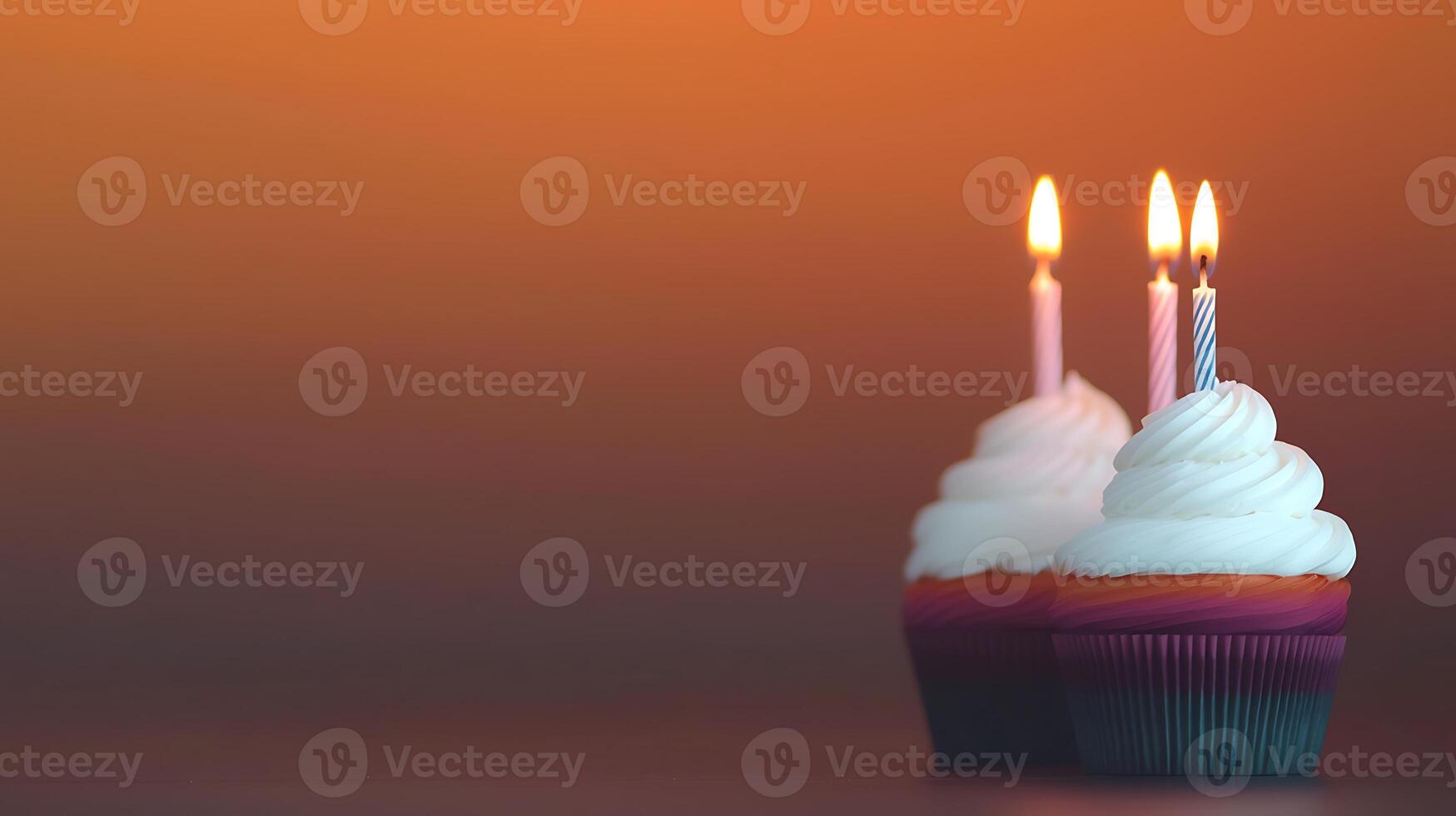 Colorful cupcakes with lit candles celebrating a birthday against a warm gradient background photo