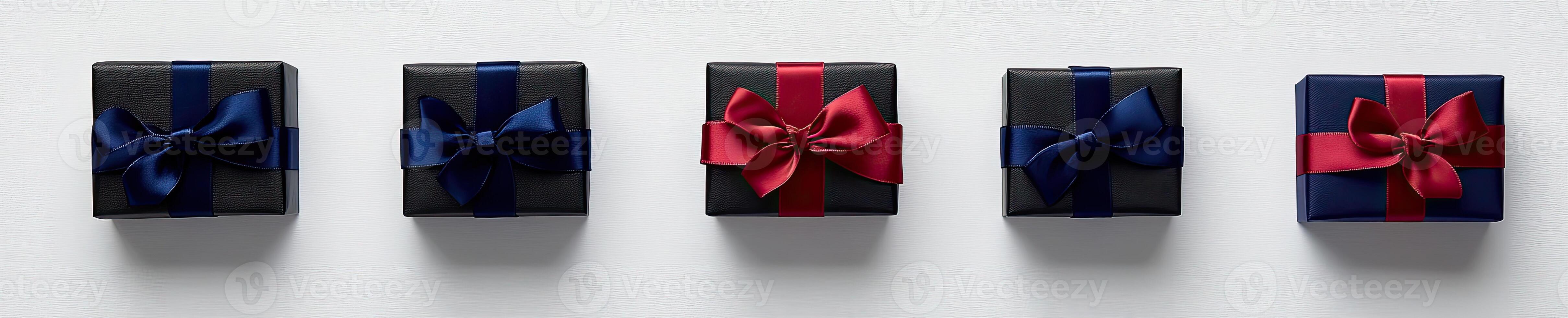 Four black and red gift boxes with bows photo
