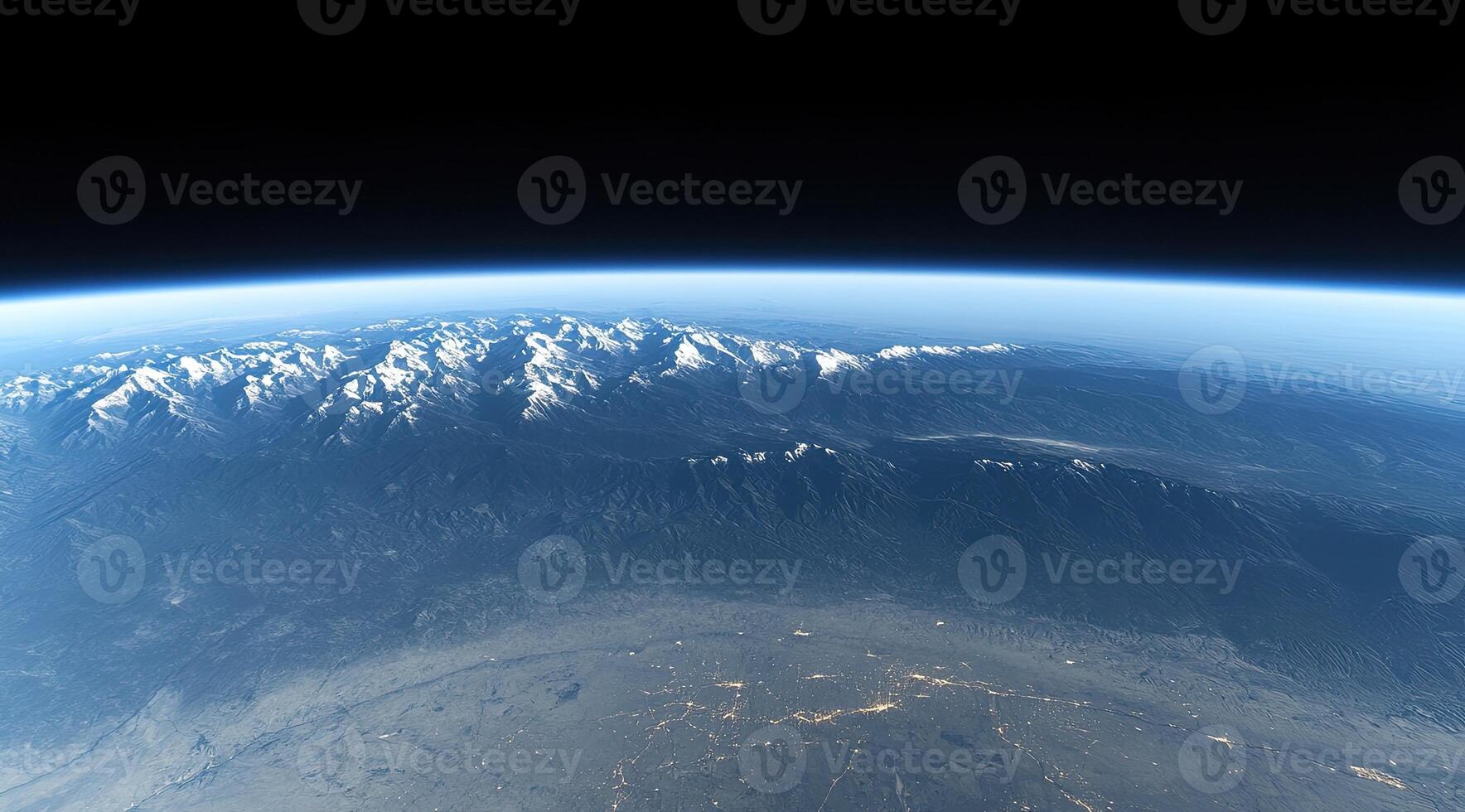 Earth's mountains and valleys from space. Vast mountain ranges with snowy peaks, valleys, and clouds, detailed view photo