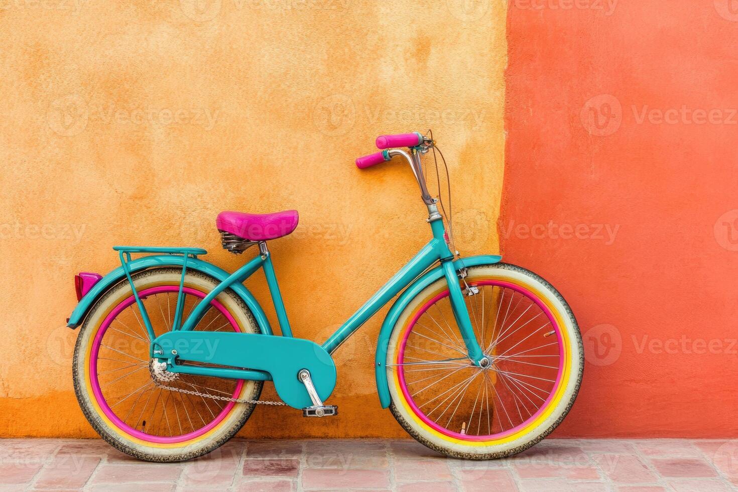 Vibrant teal bicycle against a coral and orange wall photo