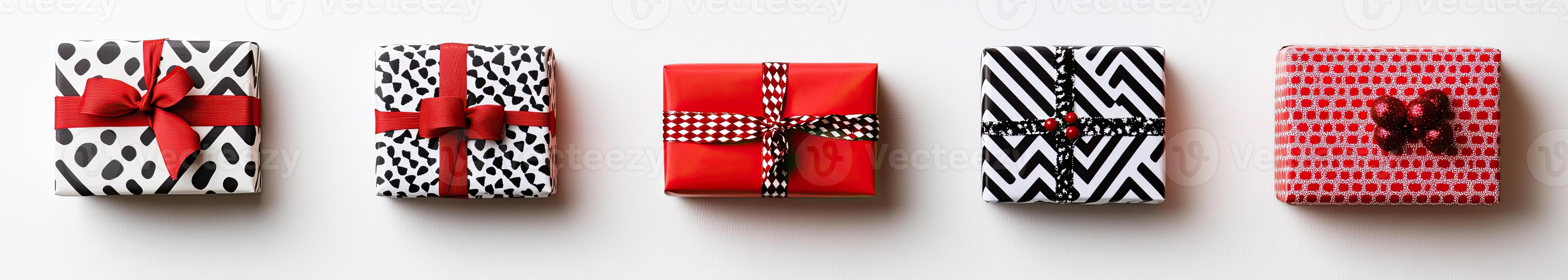 Four wrapped presents with red and black ribbon photo