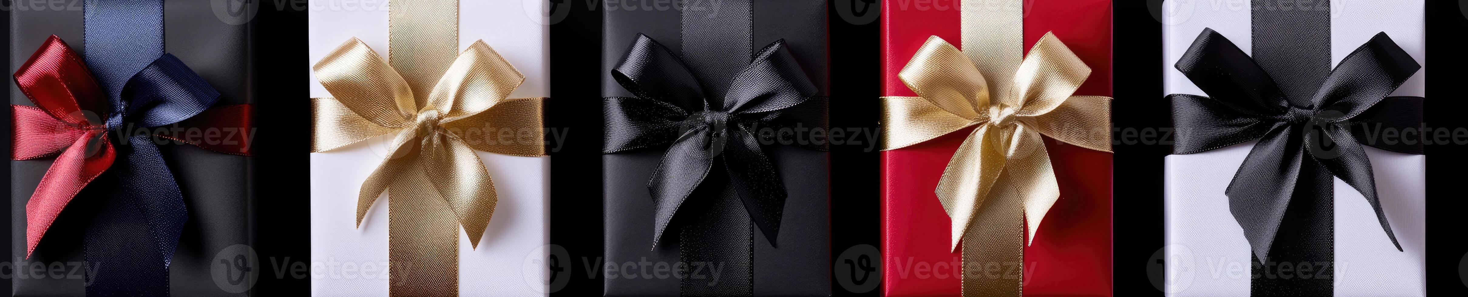 A set of six black, red, and gold gift boxes photo