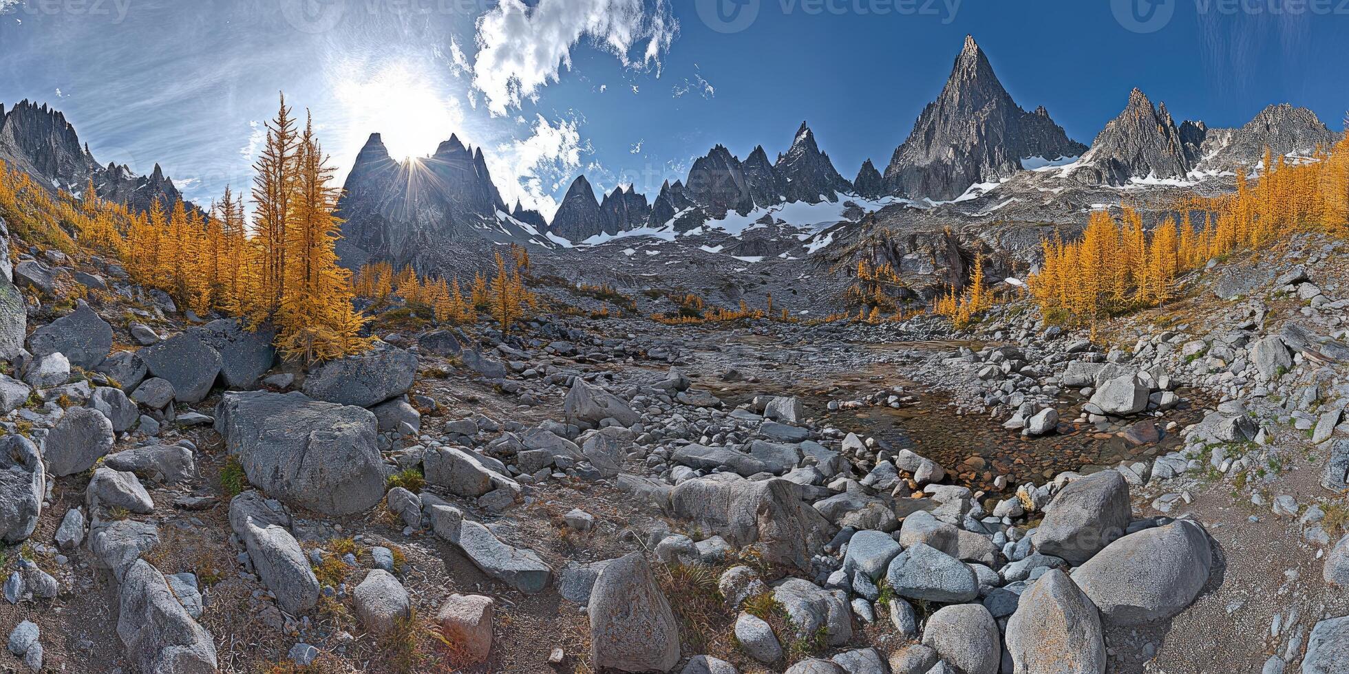 A panoramic view of a mountain range with rocks and trees photo