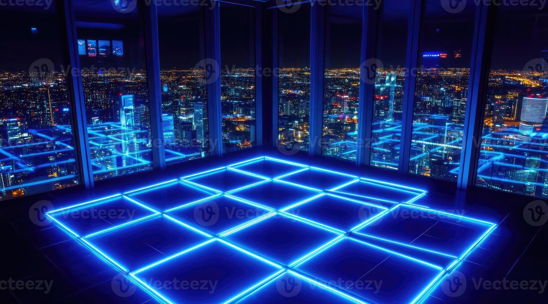 Elevated view of a city at night, with a glowing blue floor pattern photo