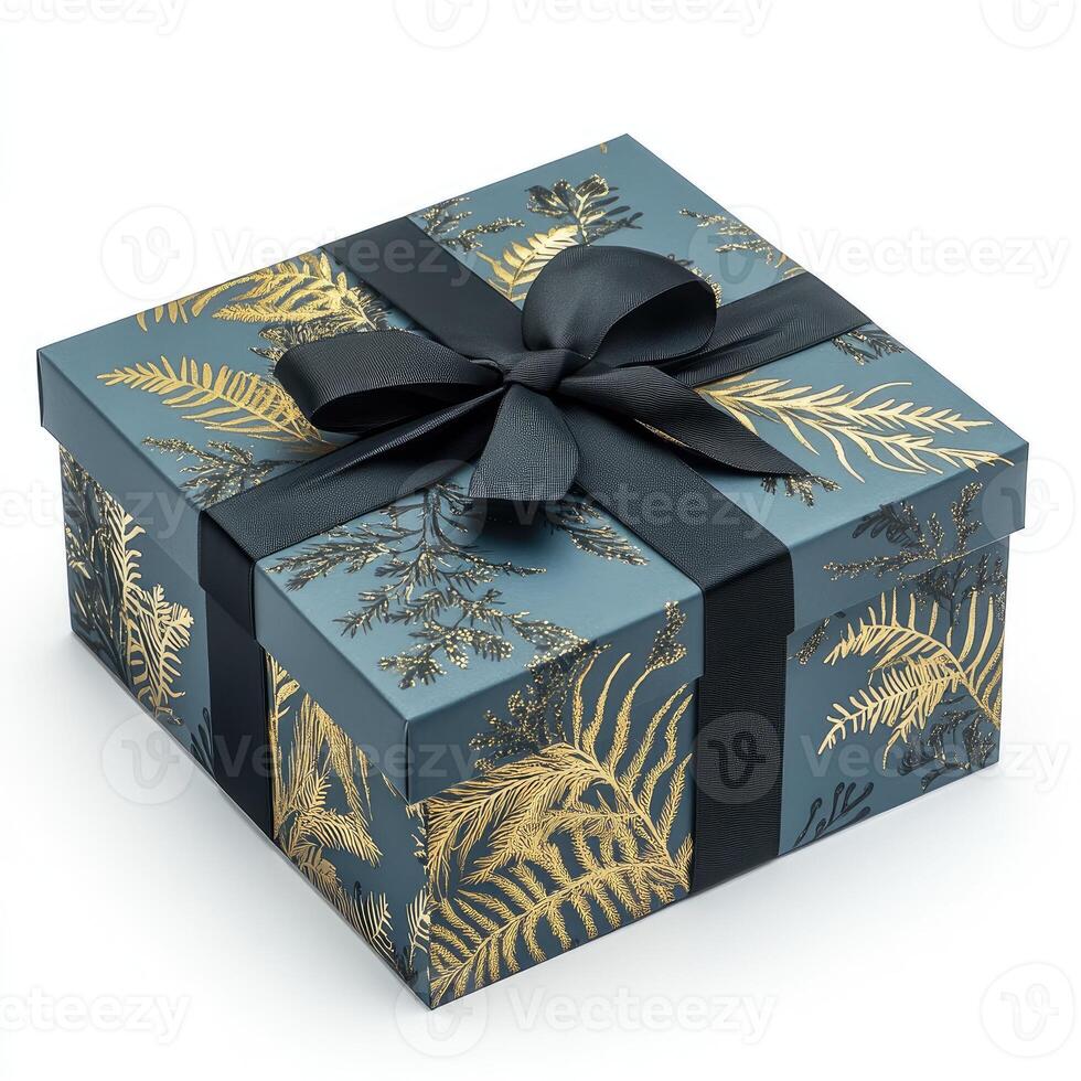 A gift box featuring a dark gray background with gold fern print. A black ribbon is tied in a bow on top photo