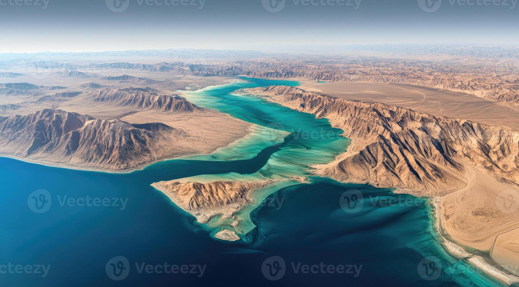 Aerial view of a desert coastline with turquoise waters photo