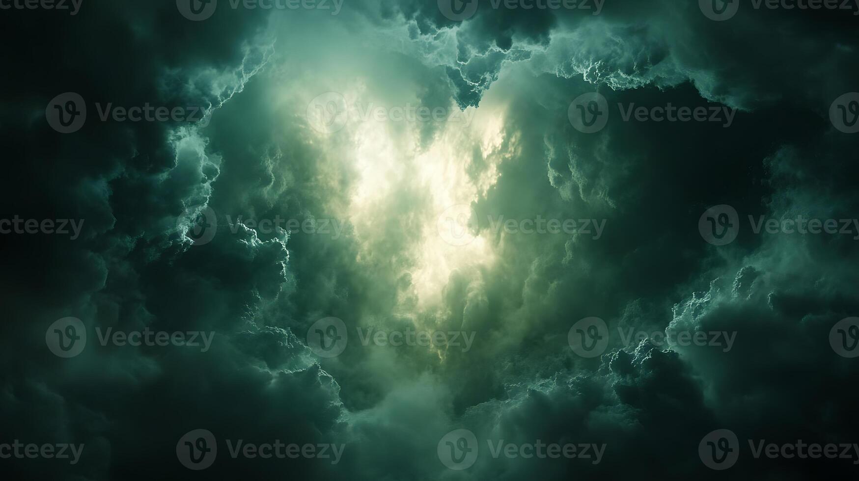 Dramatic Sky with Glowing Light Emerging Through Dark Clouds photo