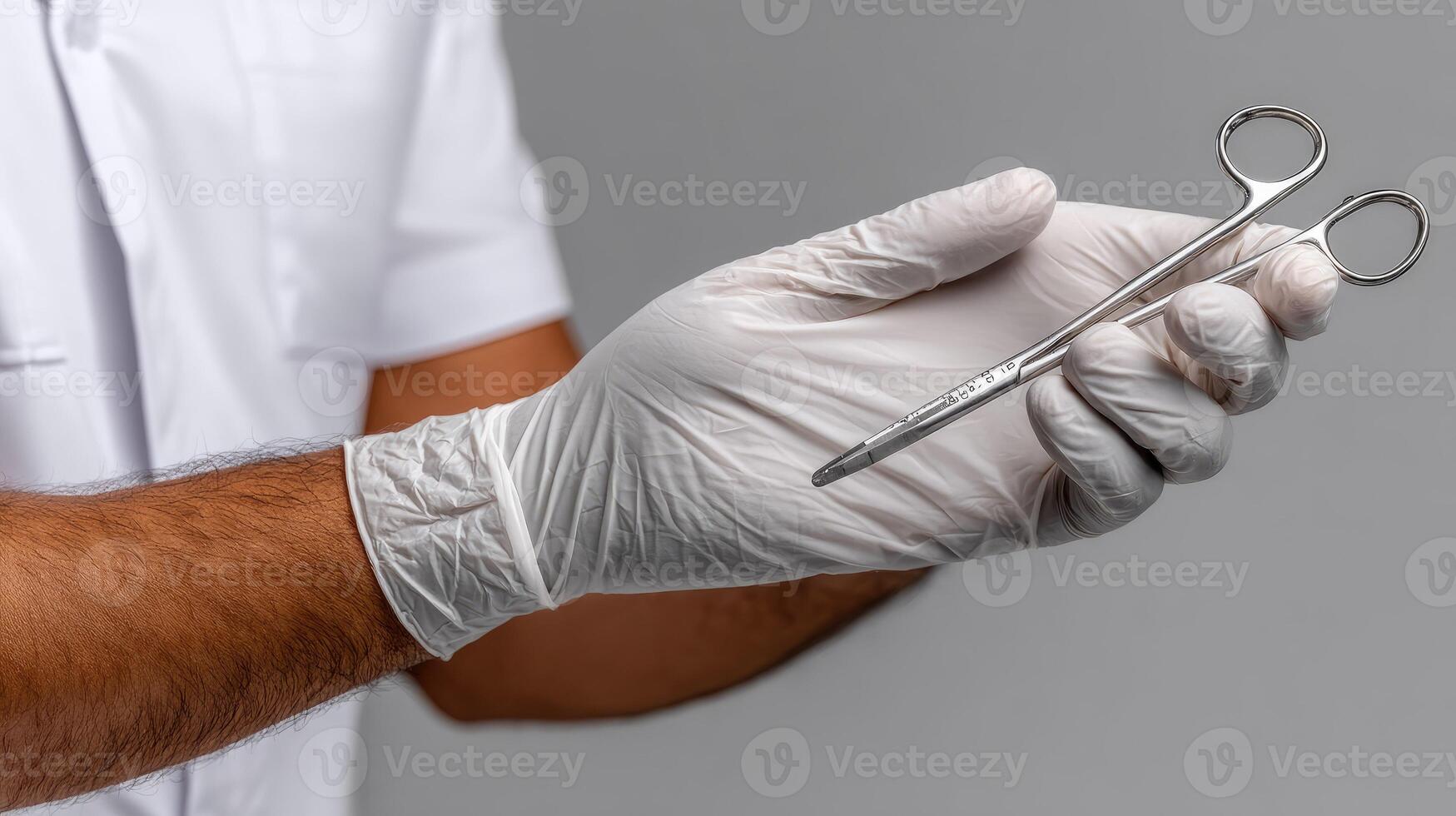 A man in white gloves holding a pair of scissors photo