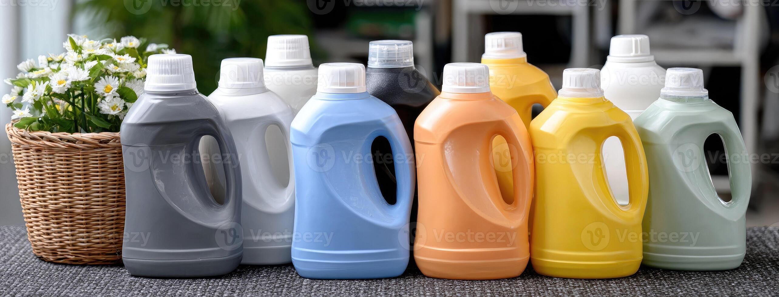 A group of different colored plastic bottles and a basket photo