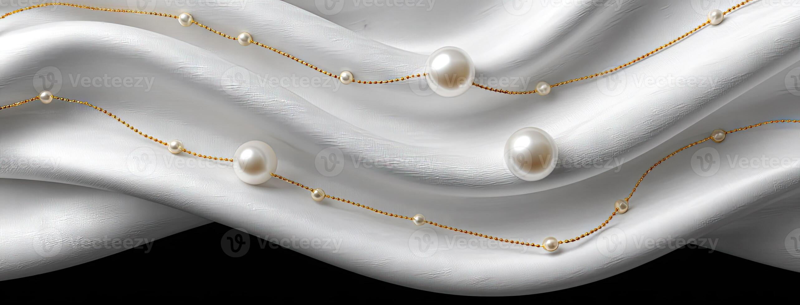 A white cloth with pearls and gold chains photo
