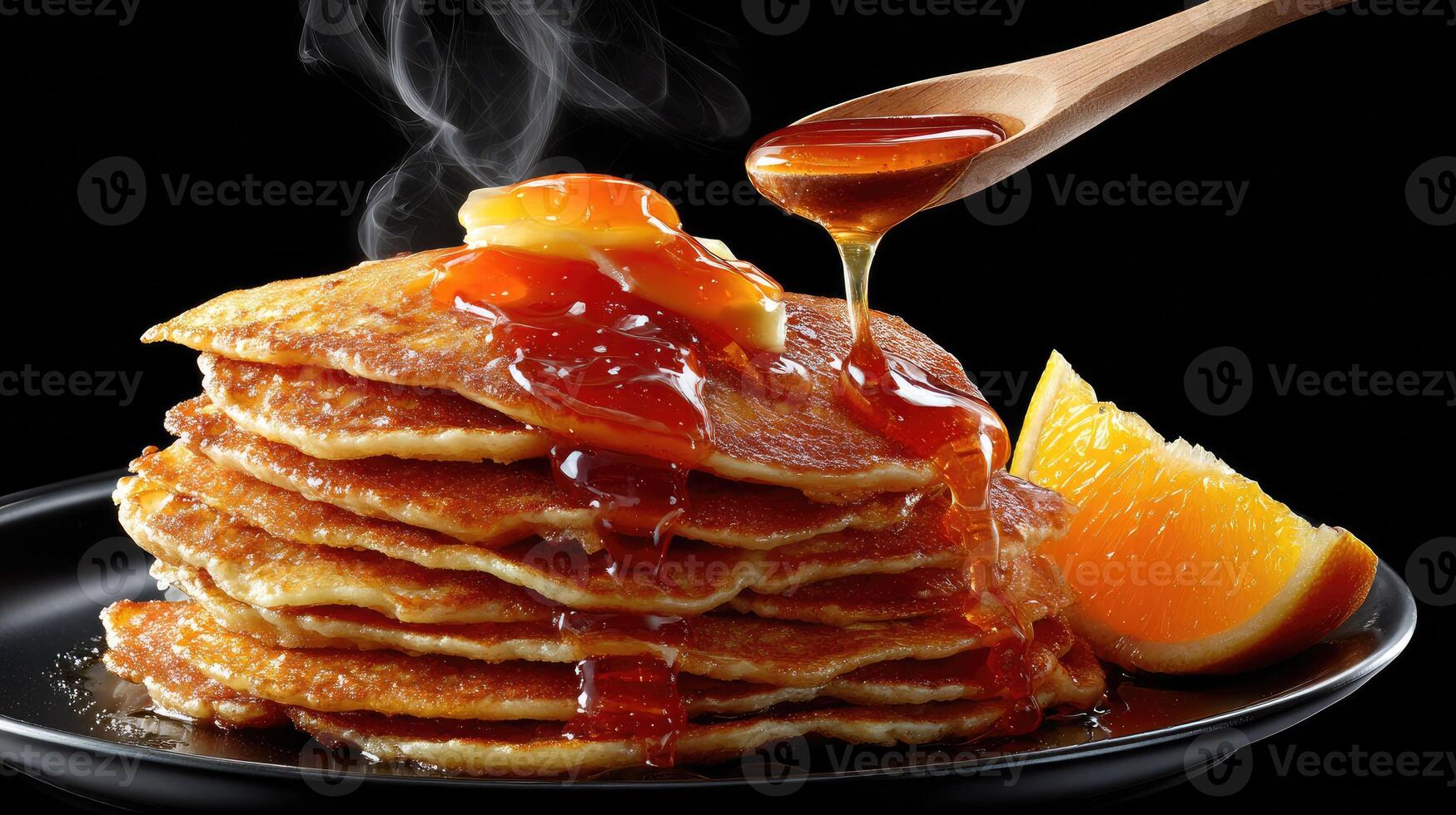 A stack of pancakes with syrup and orange slices photo