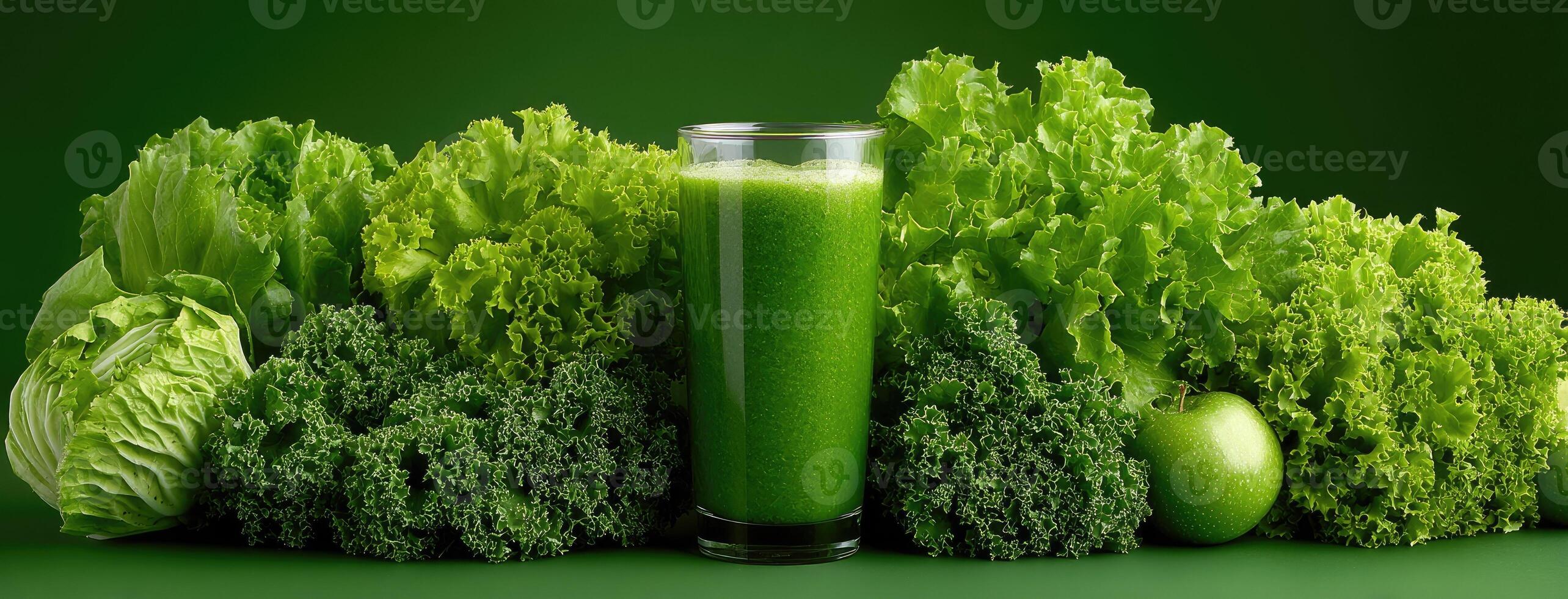 Green juice in a glass with lettuce and other vegetables photo