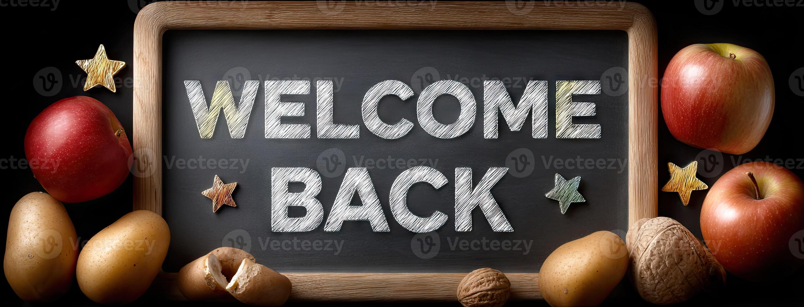 Welcome back sign with apples, nuts and a blackboard photo