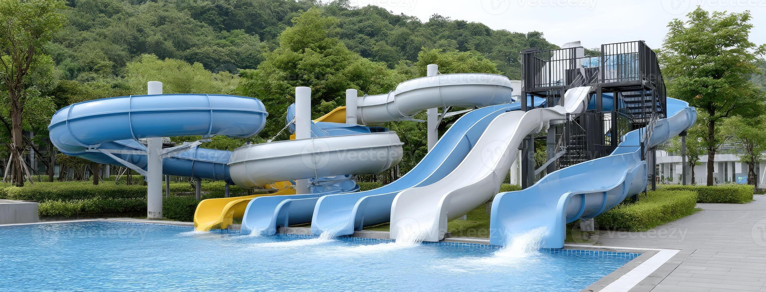 A large blue and yellow water slide in a pool photo