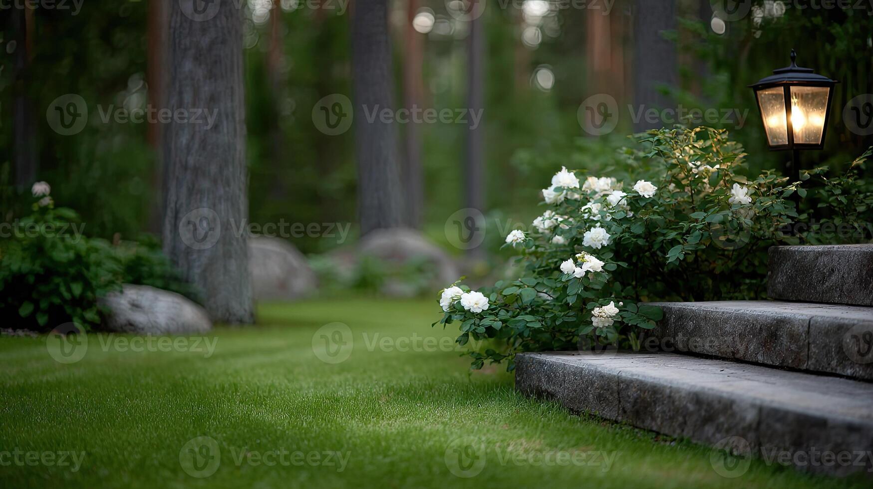A stone path leads to a lamp and flowers photo