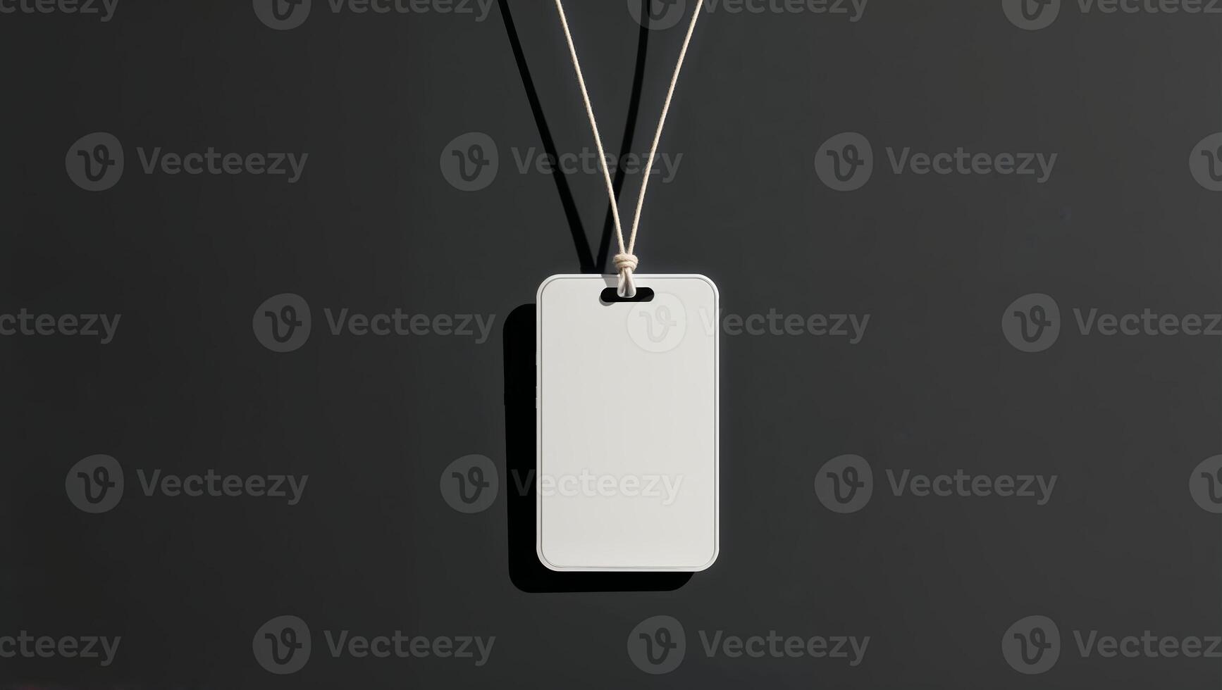 Blank tag hanging on a black backdrop for custom labeling or branding purposes photo