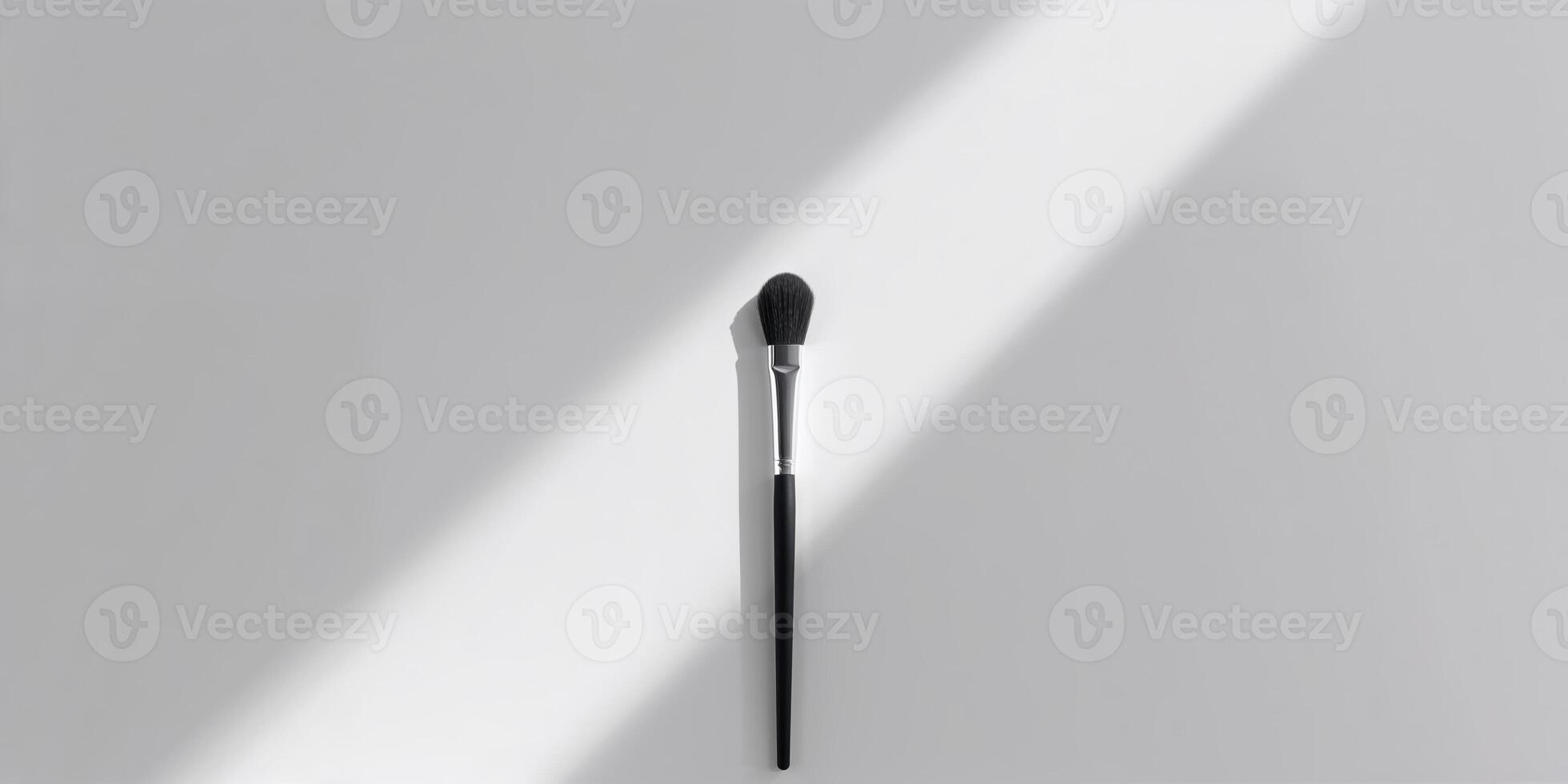 Makeup brush in soft sunlight on a light background, showcasing the simplicity and elegance of beauty tools photo