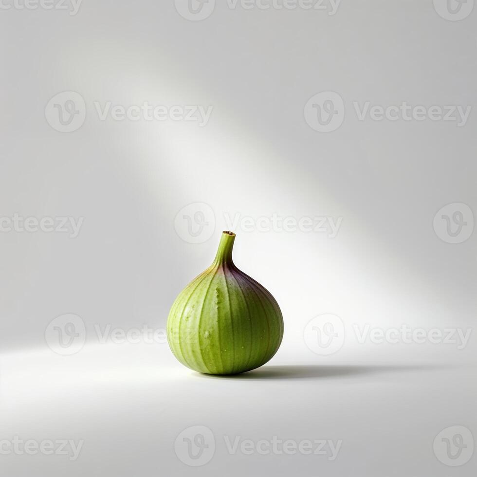 Green fig in natural light on a simple background highlighting its unique shape and texture photo