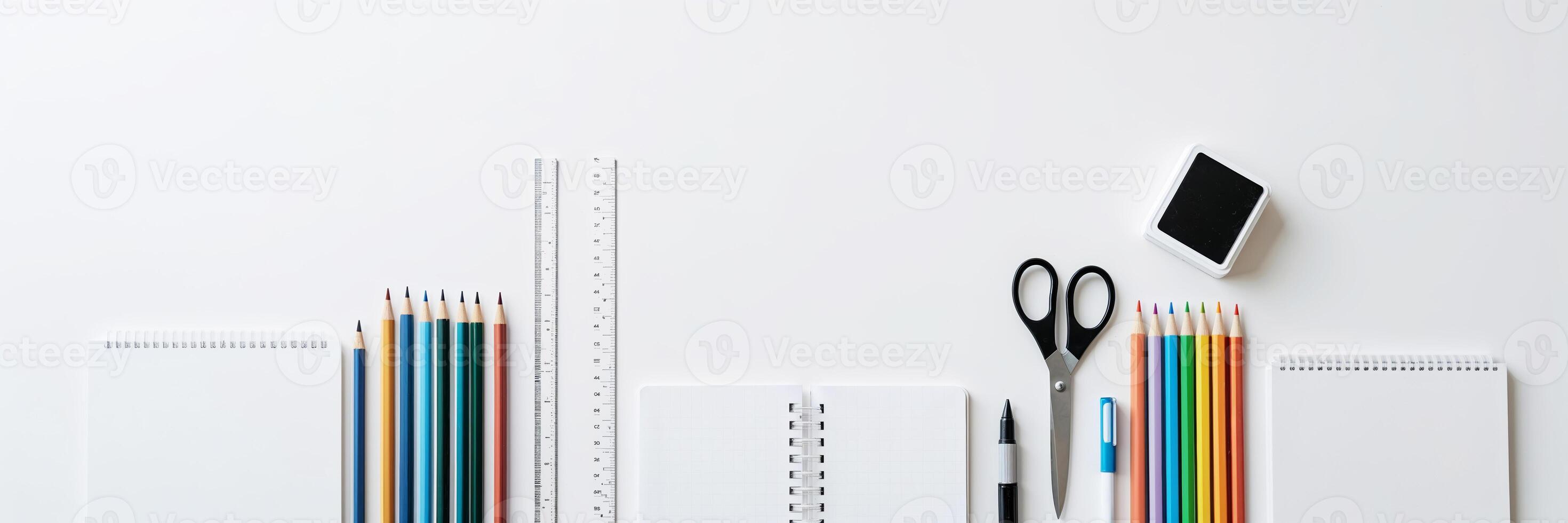 Creative workspace with colorful stationery, notebooks, and tools for artistic projects and organization photo