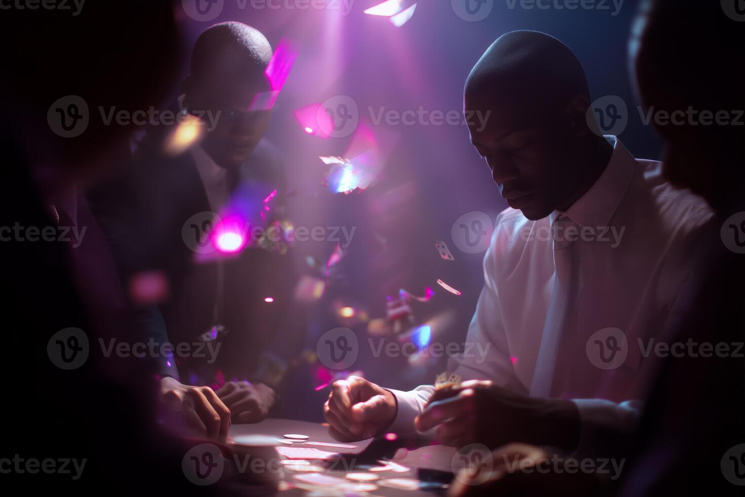 Men engage in intense card game illuminated by colorful lights during evening gathering photo