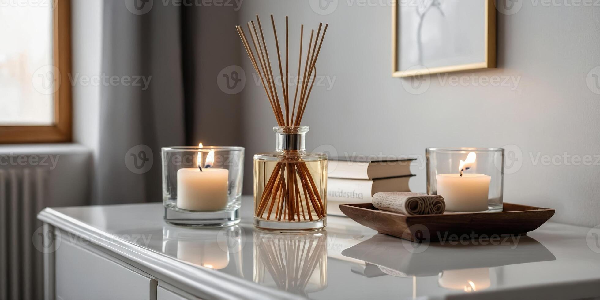 Decorative candle arrangement on a minimalist table in a cozy room with natural light streaming in photo