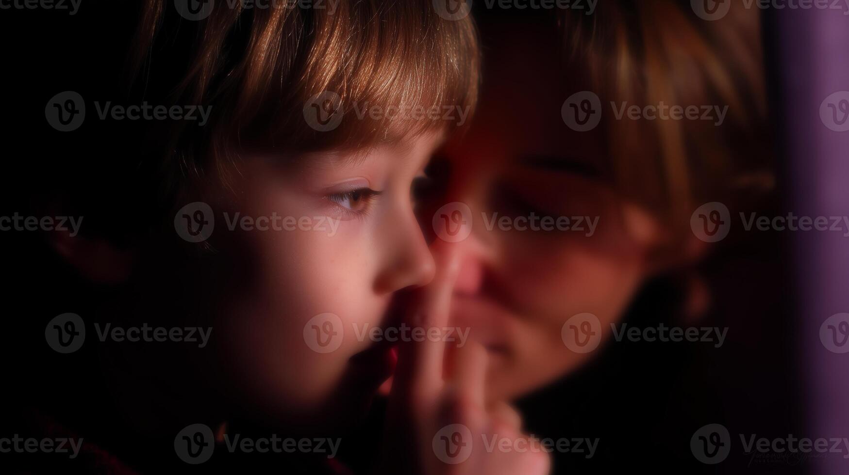Child whispers secret to parent in intimate moment at home during evening time photo