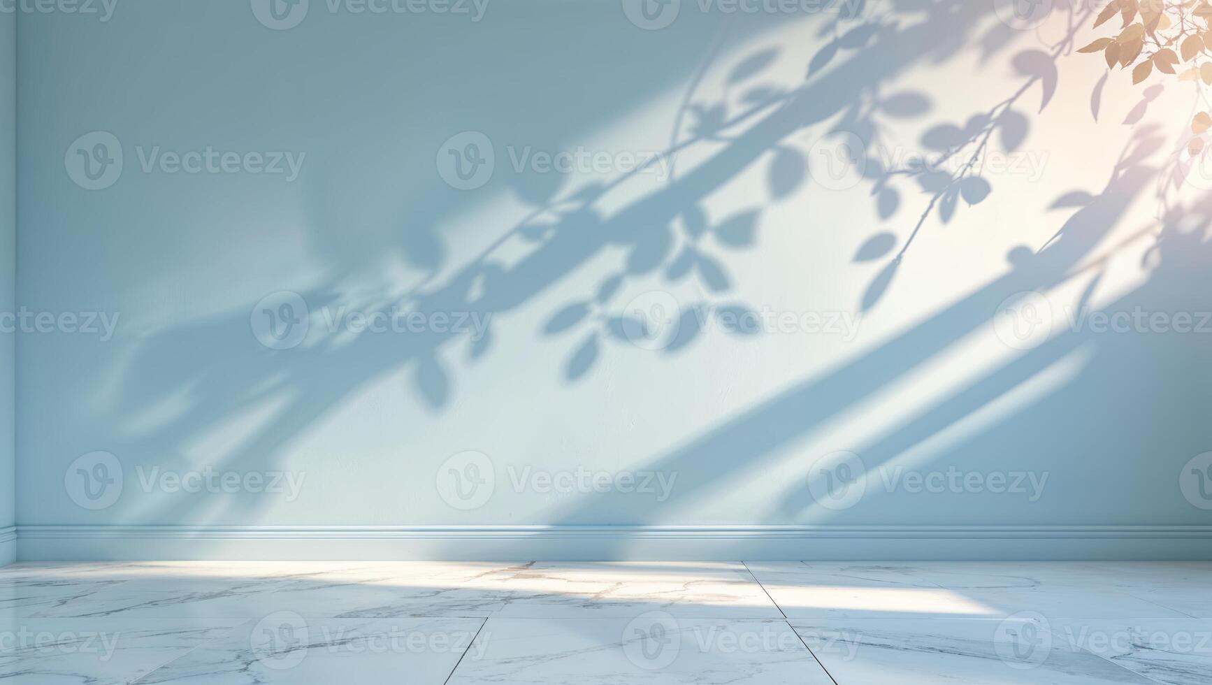 Light and shadow interplay on a blue wall with natural leaf patterns during afternoon sunlight photo