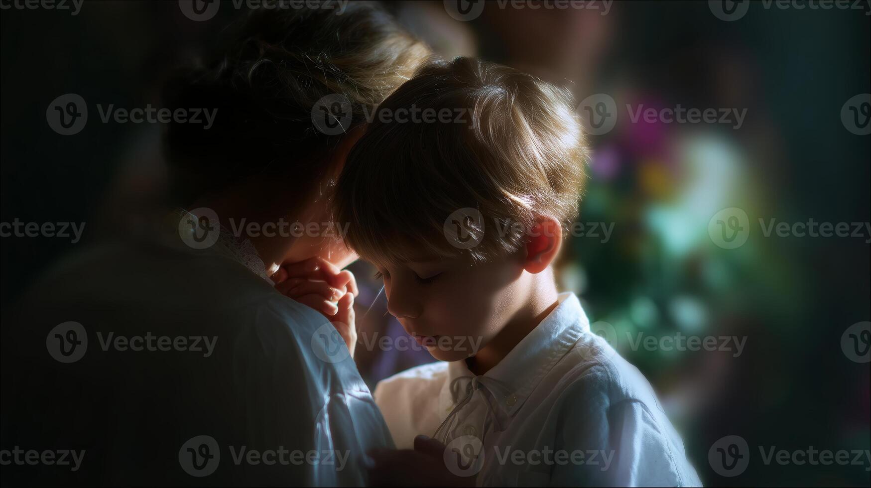 Child reflects in quiet moment with mother at a family event during the afternoon photo