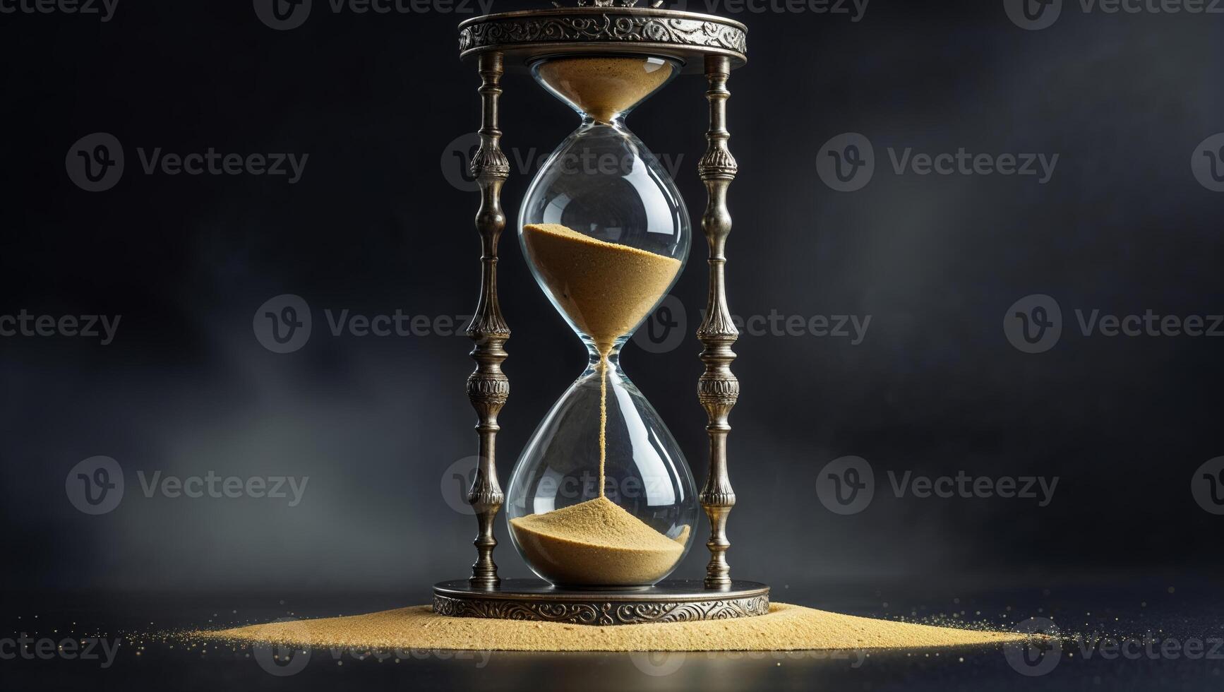 Elegant hourglass symbolizing the passage of time captured in a dimly lit setting with fine detailing on its frame photo
