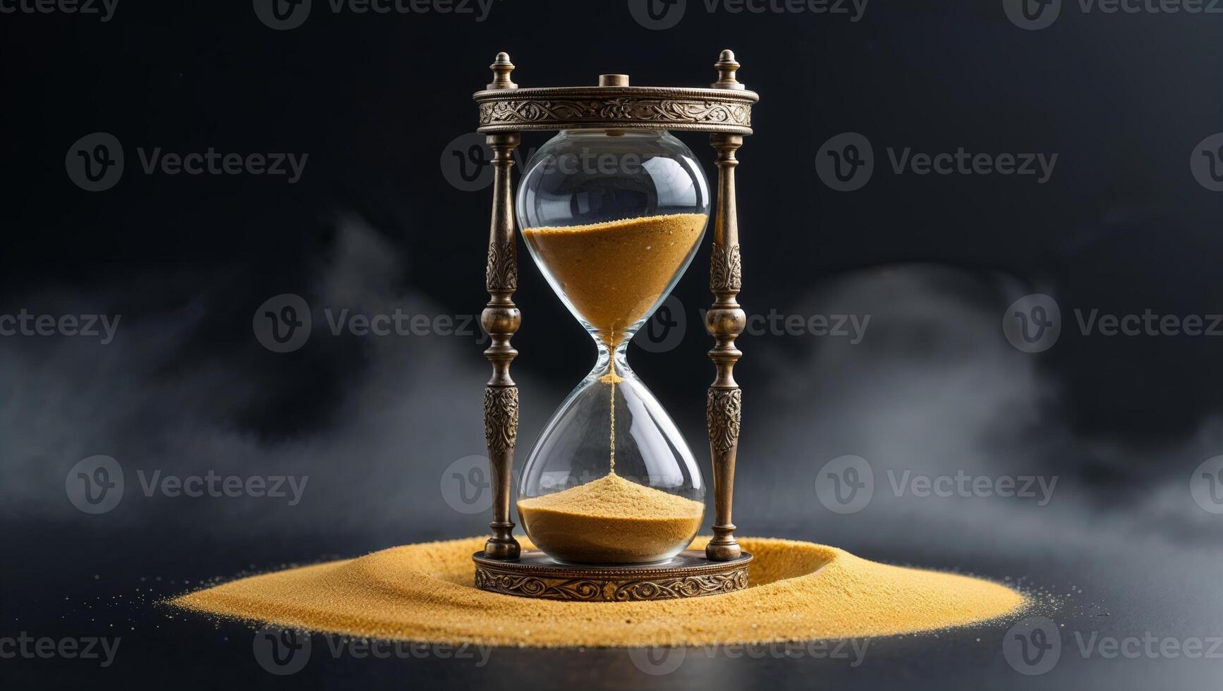 Beautifully crafted hourglass with golden sand in a misty atmosphere creating a sense of time passing and contemplation photo