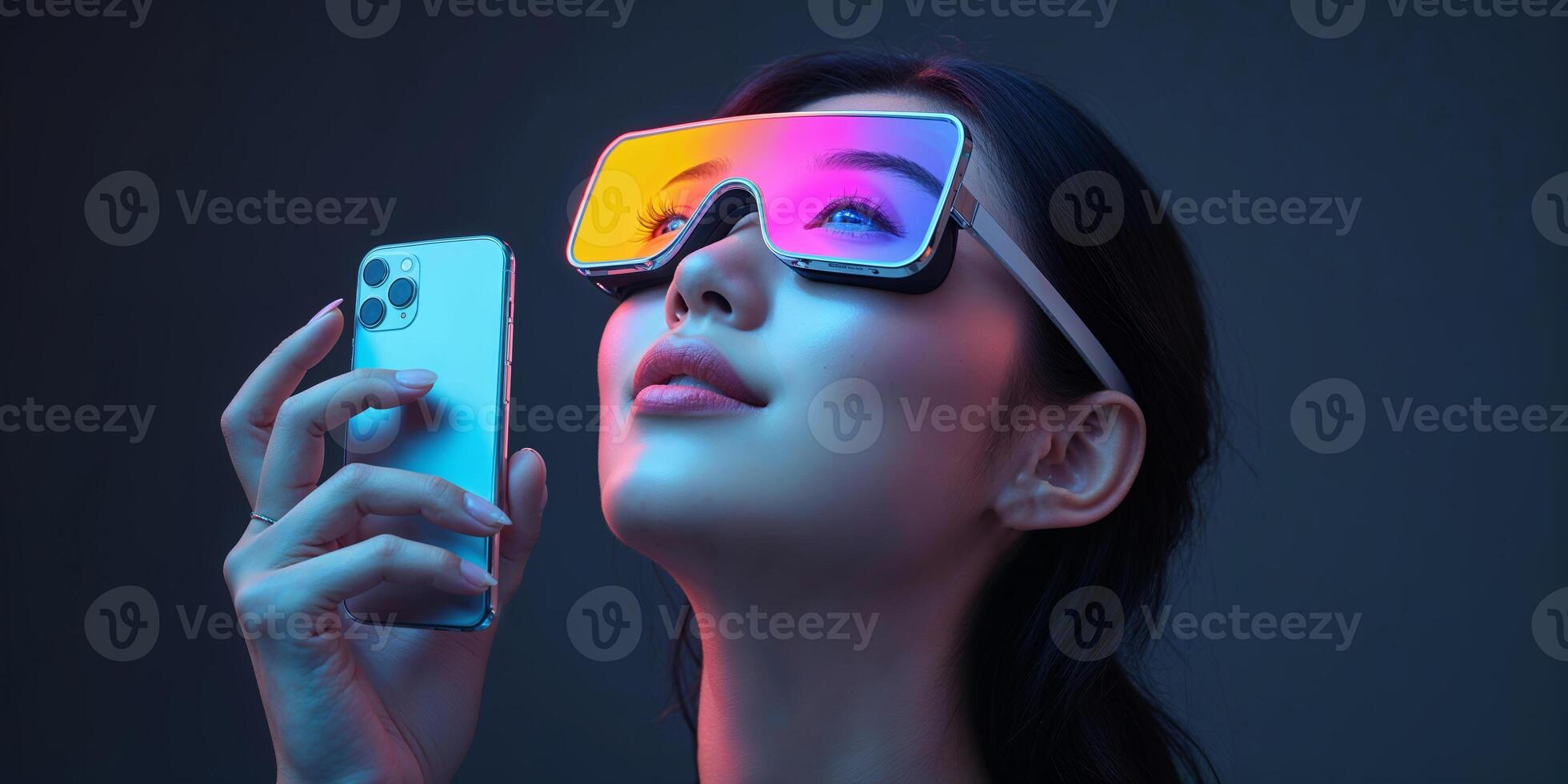 Futuristic woman wearing colorful glasses and using a smartphone under neon lighting in a modern setting photo