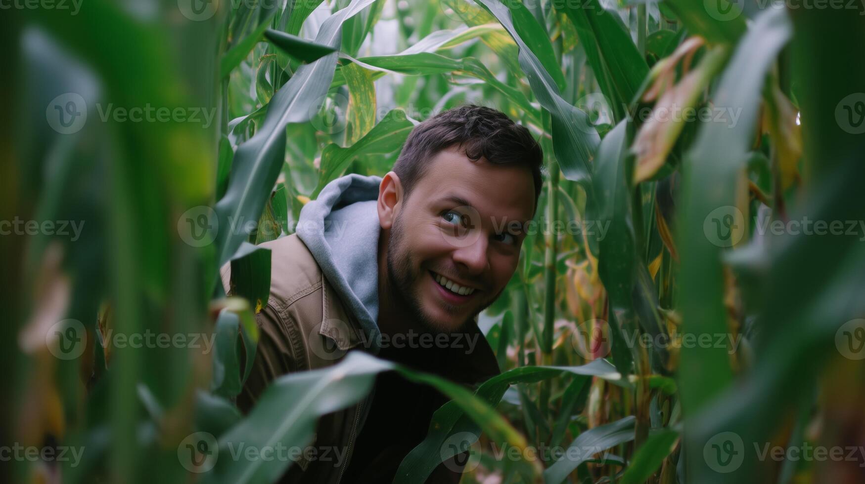 Smiling man exploring a cornfield during autumn in a rural setting photo