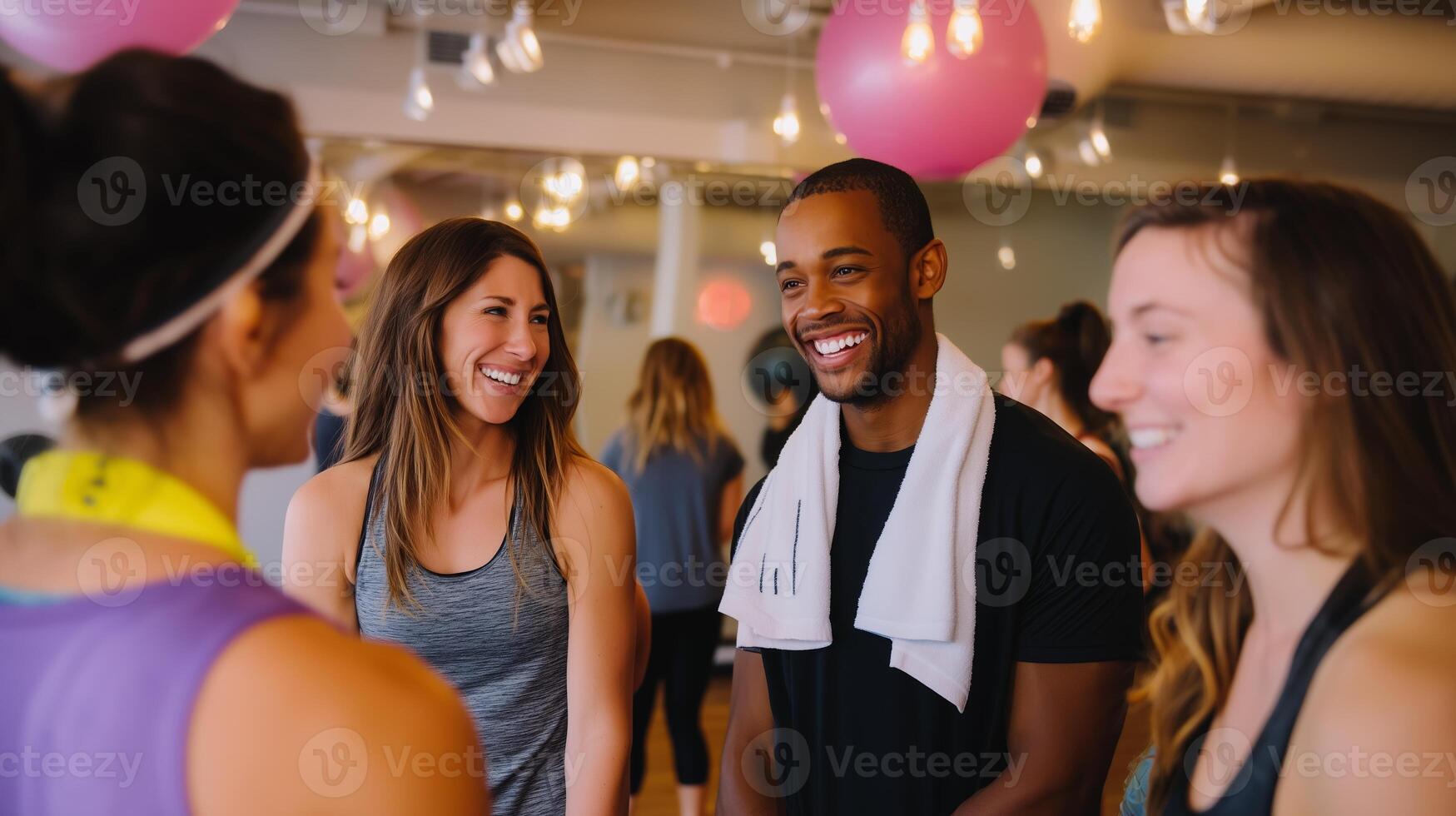 Friends enjoying a fun day of group fitness and exercise at a gym during a lively class in the morning hours photo