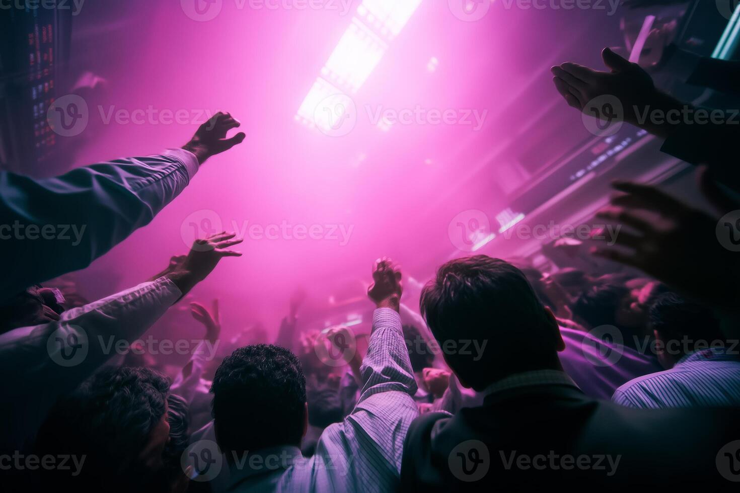 Crowd celebrates in vibrant atmosphere during a nighttime festival with energetic music and colorful lights photo