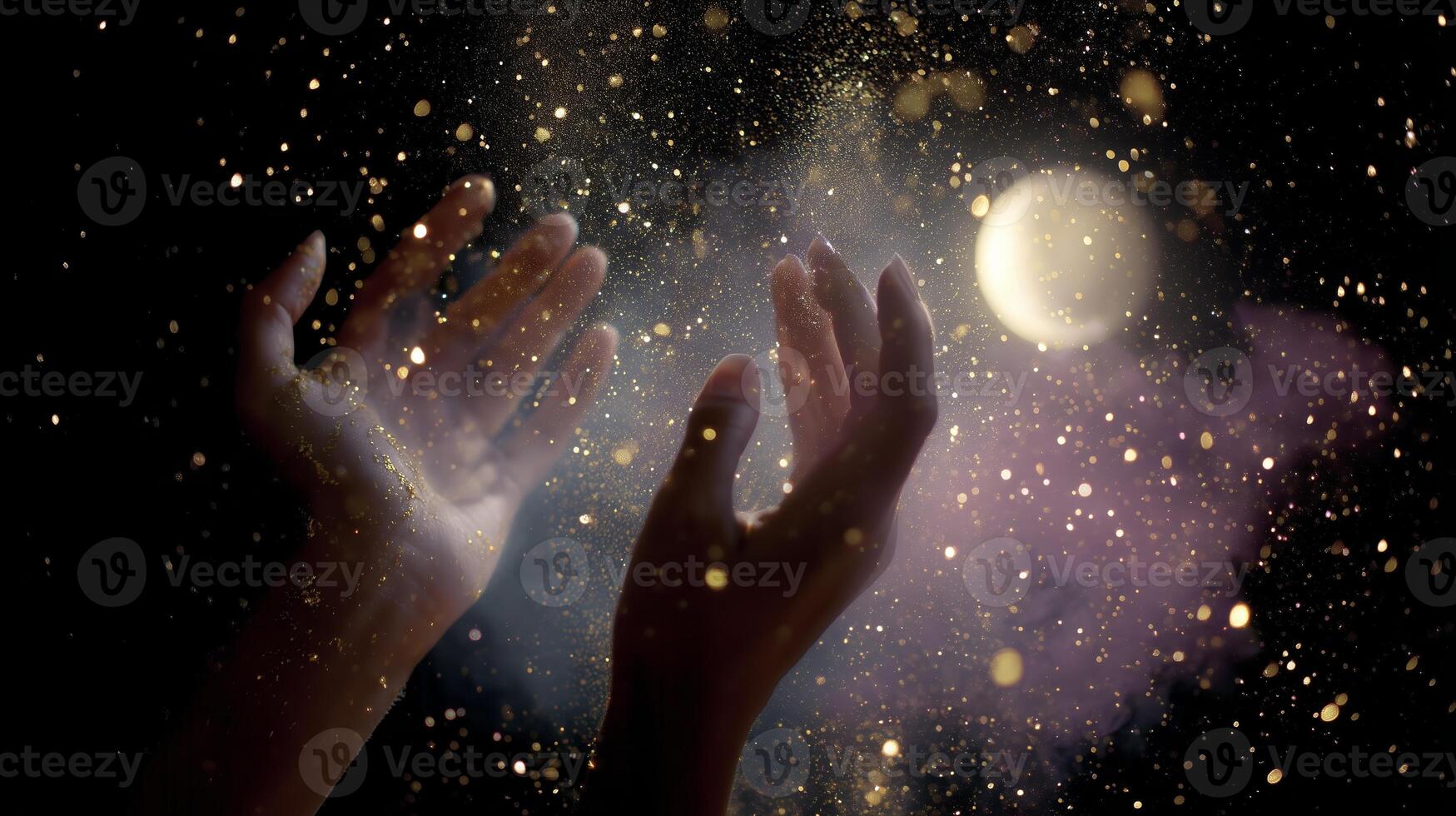 Hands reaching towards a glowing moon with swirling glitter and dust in a mystical atmosphere at night photo