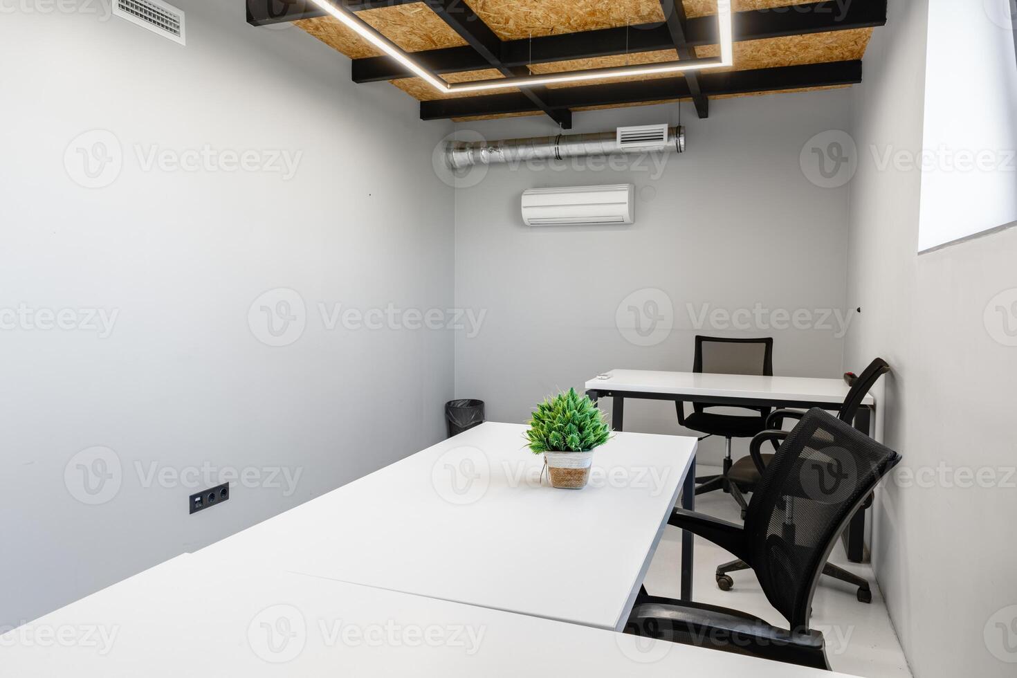 Modern workspace featuring minimalist design and functional furniture in an office setting photo