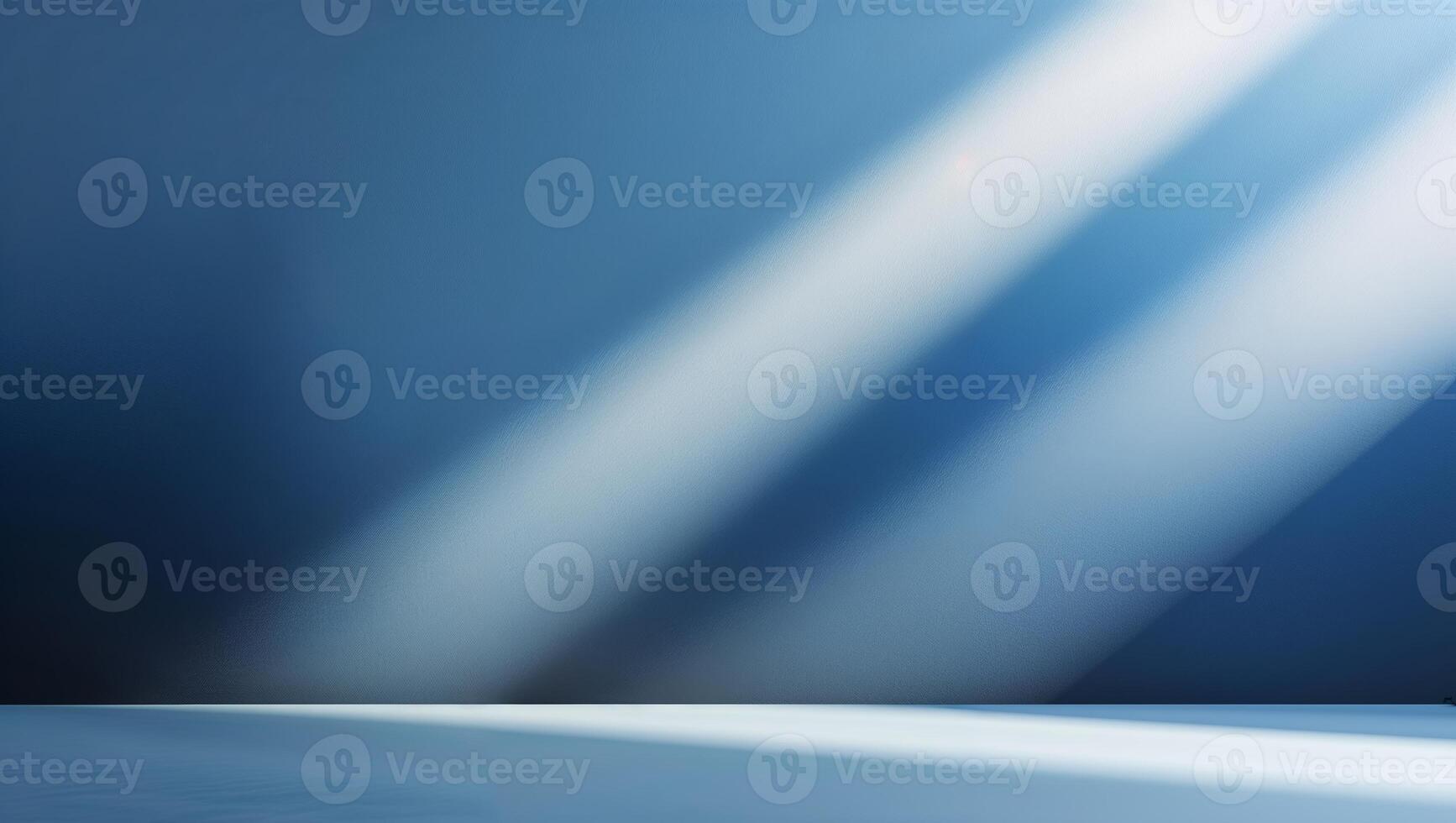 Light beams shining through blue wall illuminating a simple space during daylight hours photo