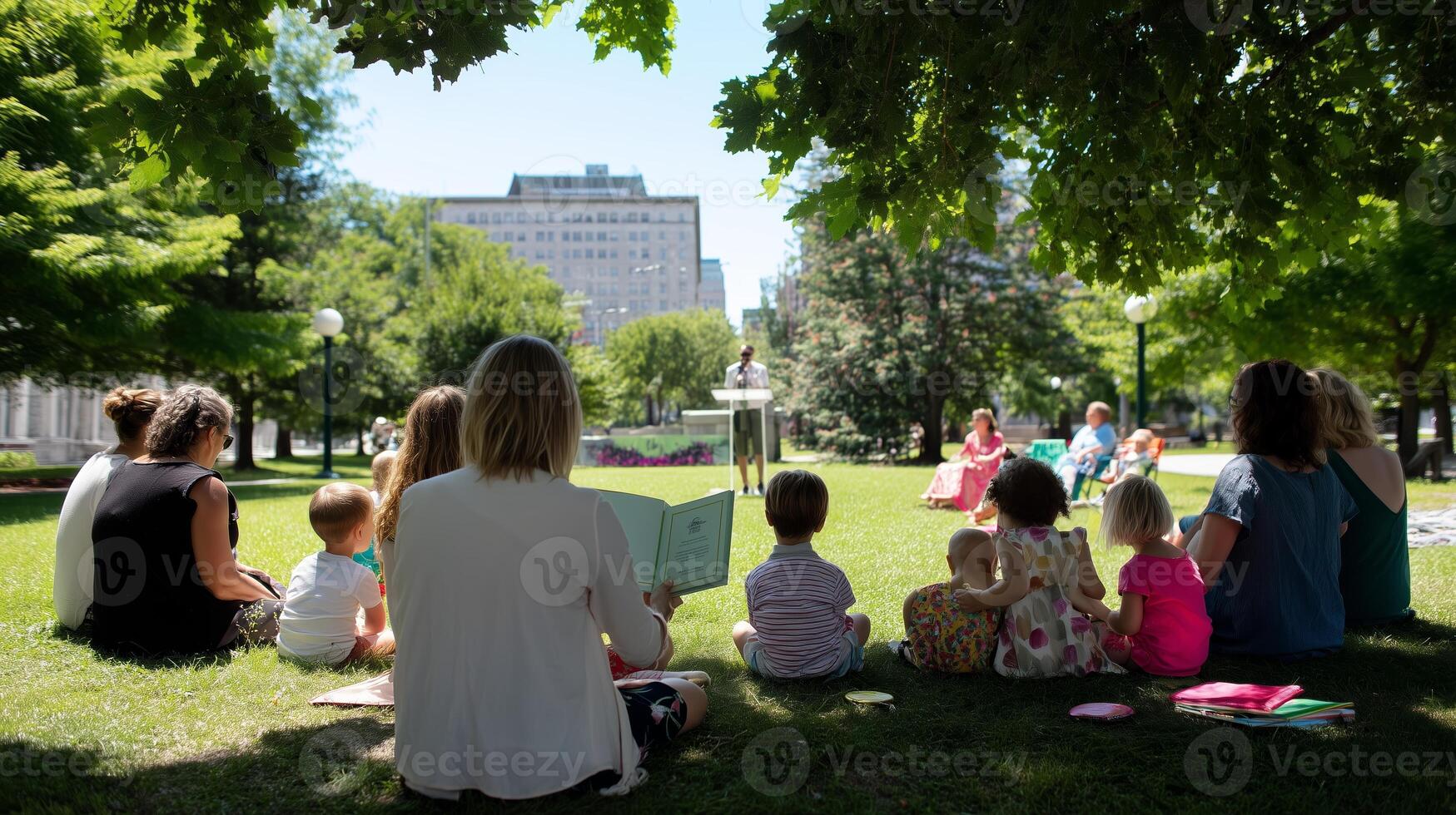 Families enjoy storytime in a park surrounded by greenery and laughter during a sunny day in the city center photo