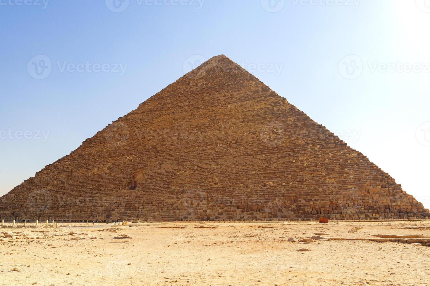 Majestic pyramid stands tall under bright sky at Giza, showcasing ancient Egyptian architecture and history photo