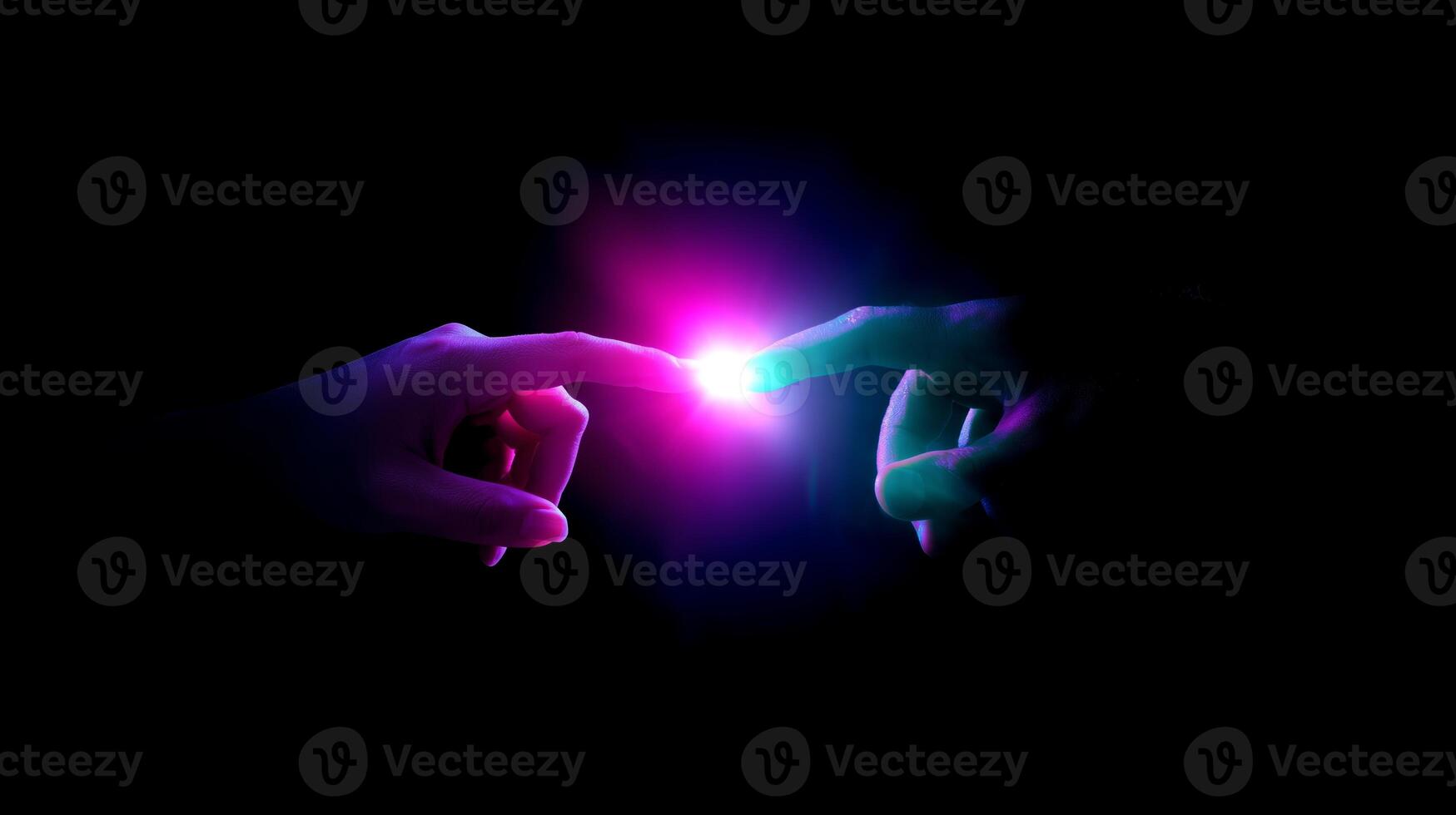 Light touches create a connection between two hands in a darkened space during a dramatic moment of interaction photo