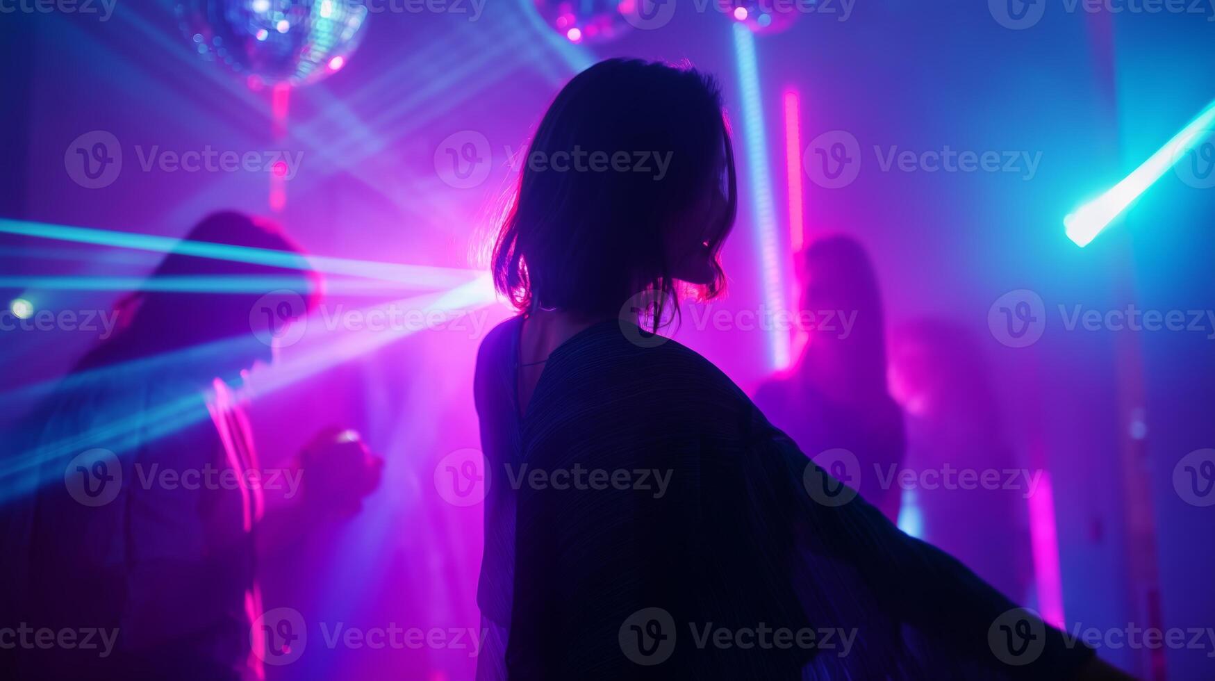 Vibrant party atmosphere with colorful lights and silhouettes dancing in urban nightlife photo
