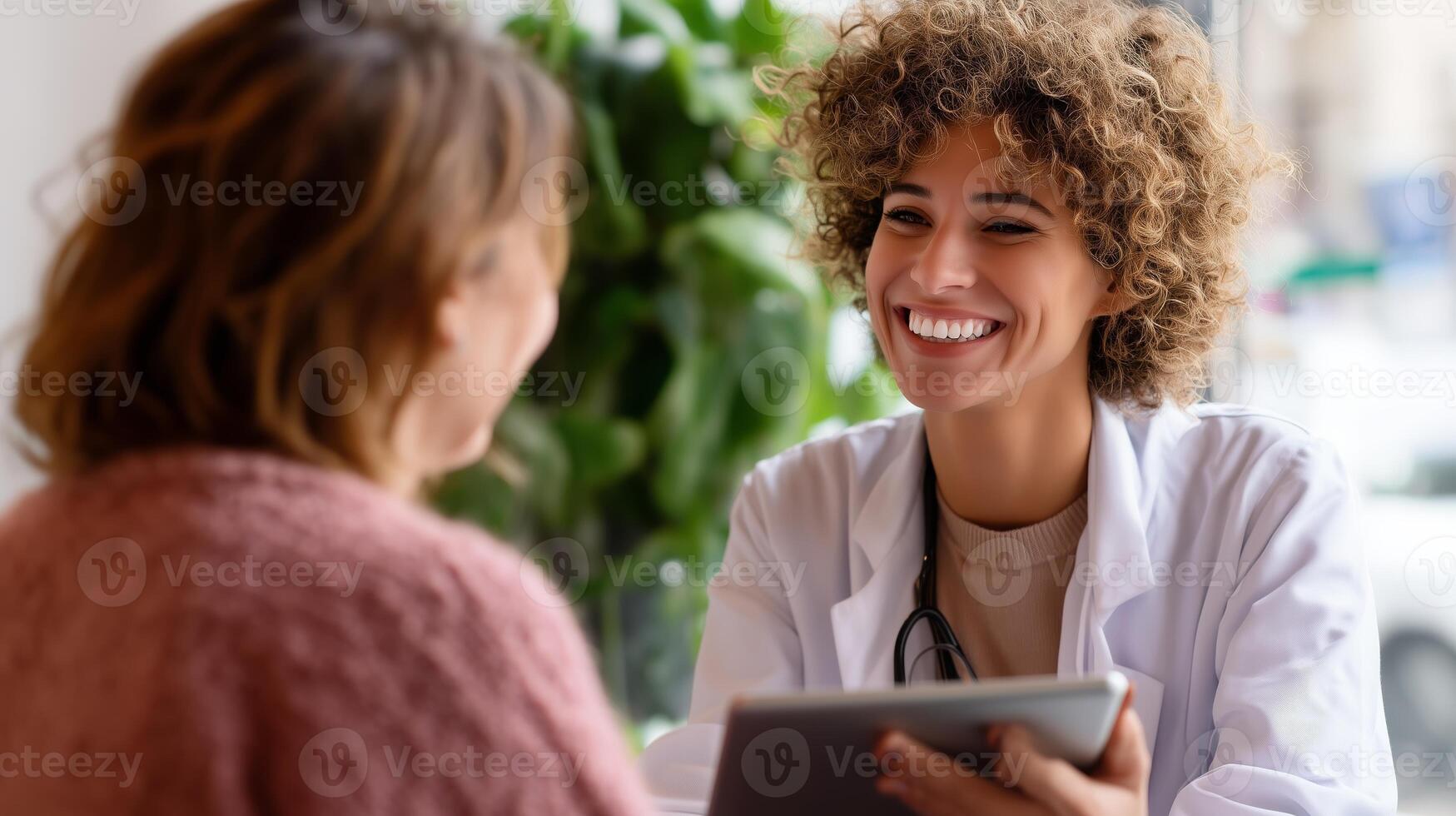 Friendly healthcare provider consulting with a patient in a sunny clinic during the daytime photo