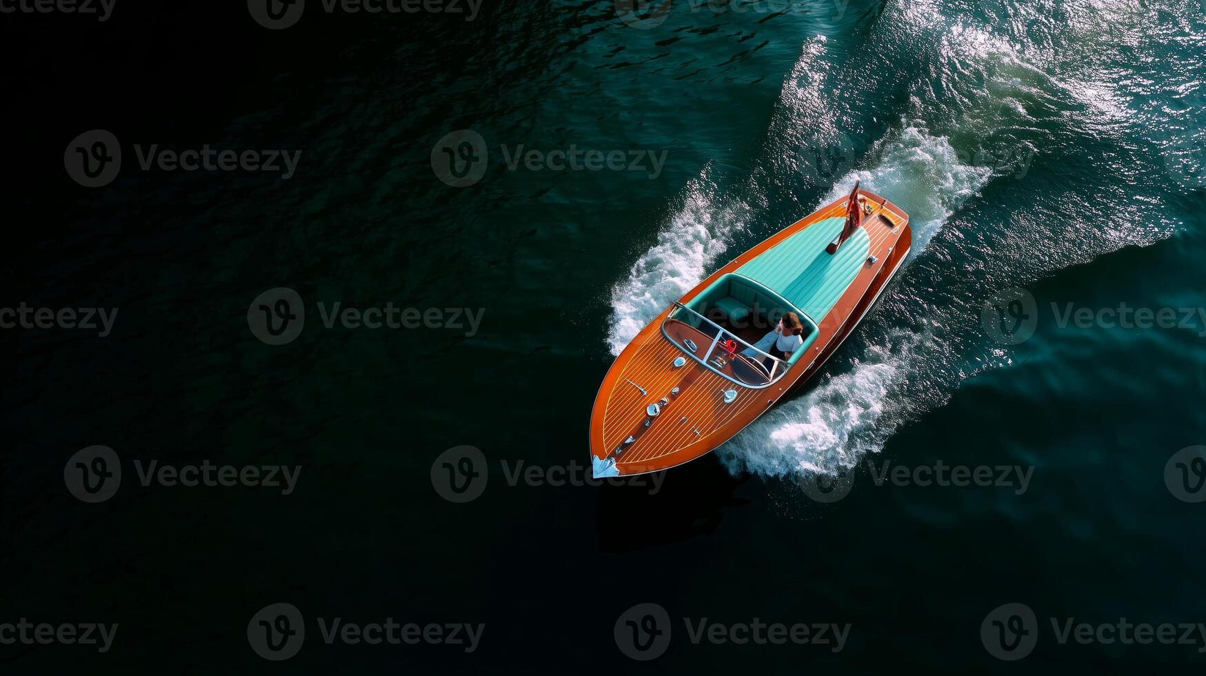 Speeding across calm waters in a vintage boat under clear skies during a sunny afternoon photo