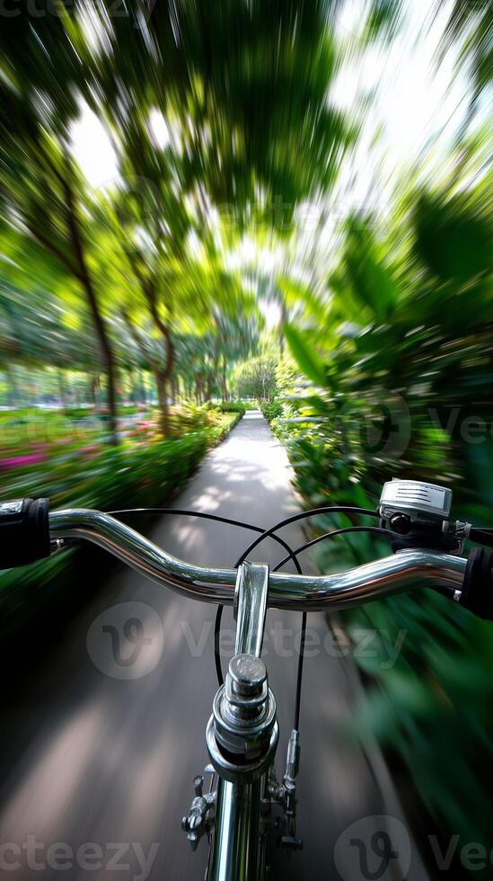 Cycling along a lush green path in a vibrant park during daylight hours photo