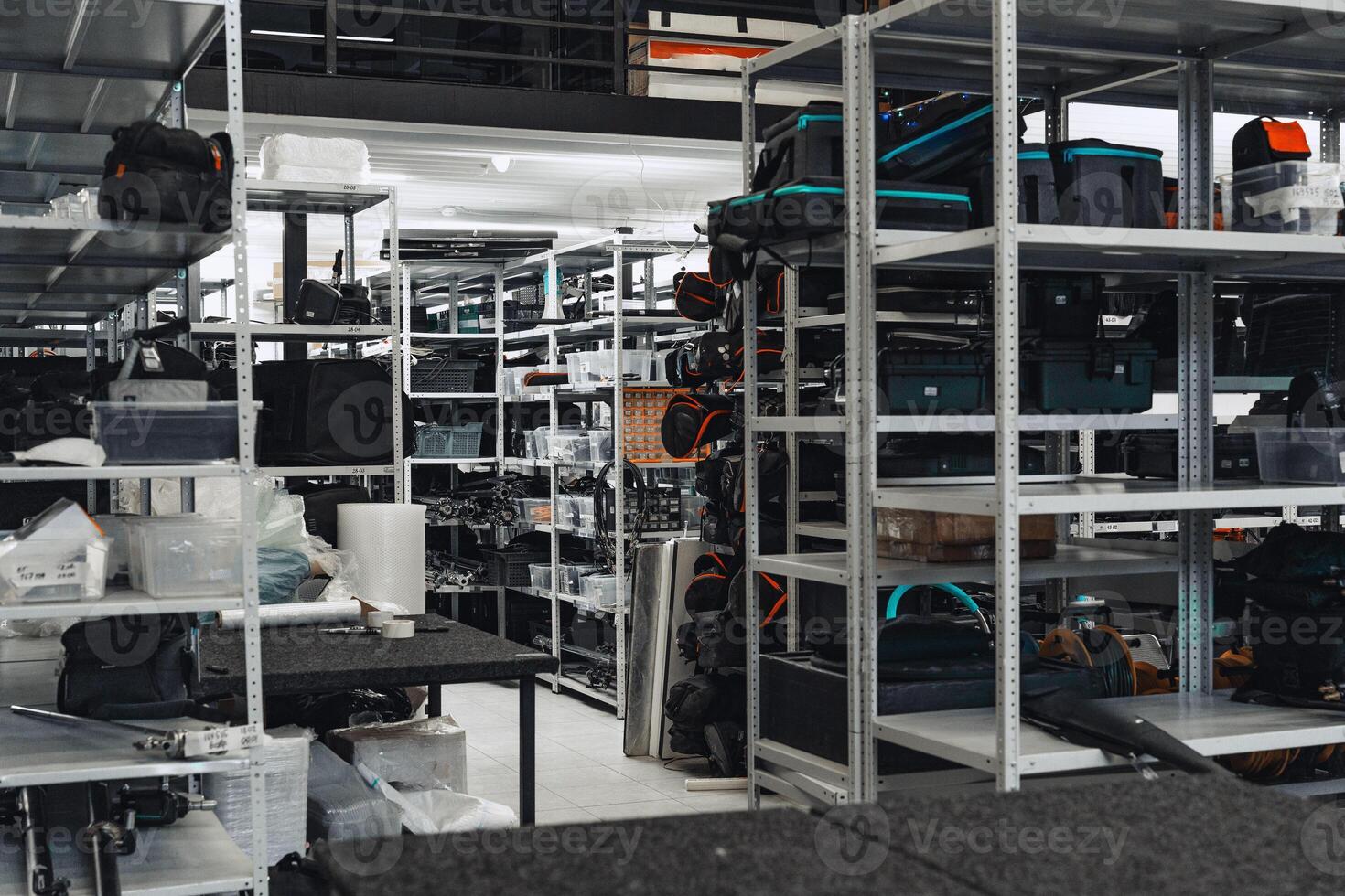 Storage area filled with camera equipment and accessories in a well-organized warehouse photo