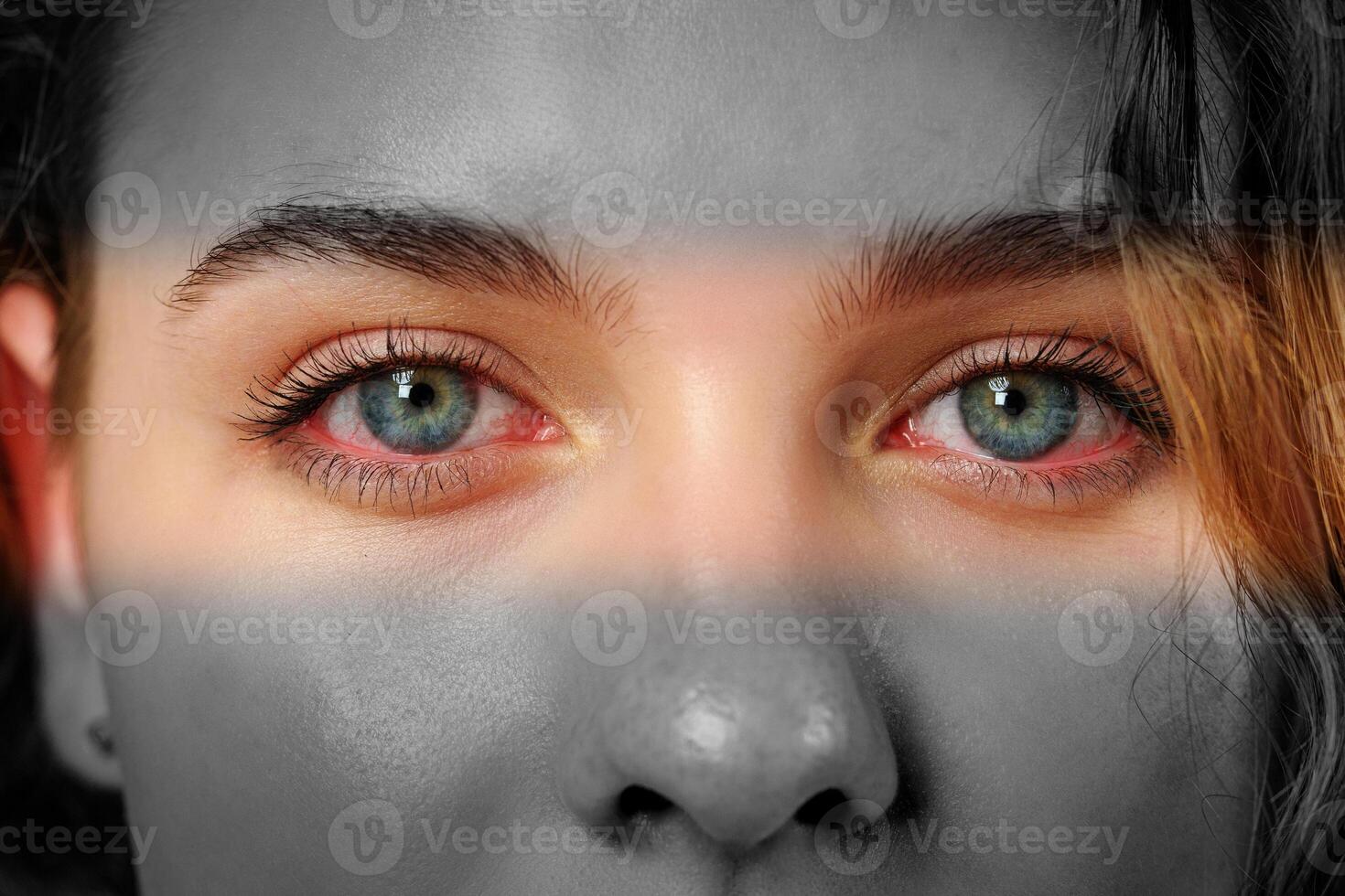 Captivating gaze with striking blue eyes highlighted in a black and white portrait photo