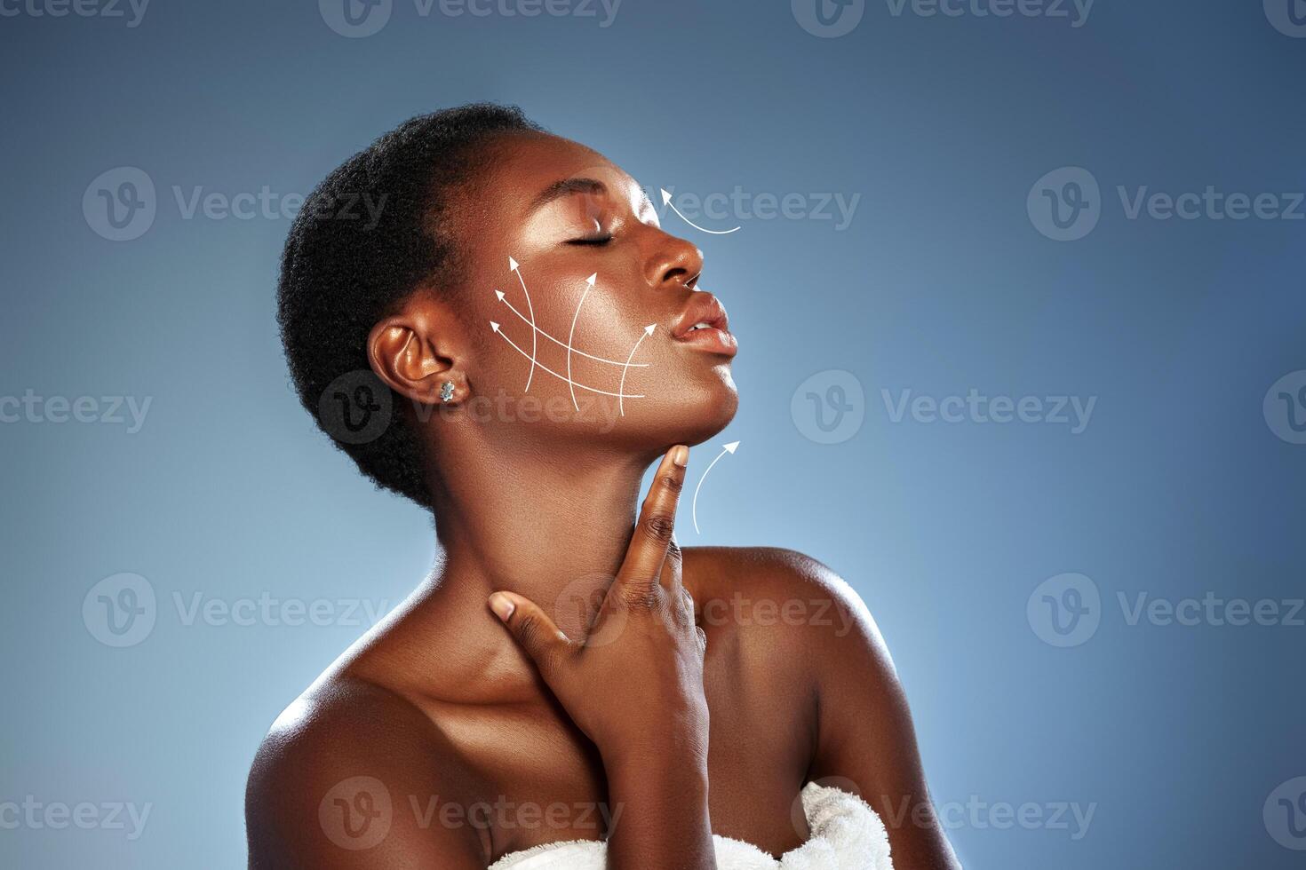Skincare techniques demonstrated by model with radiant skin in beauty studio photo