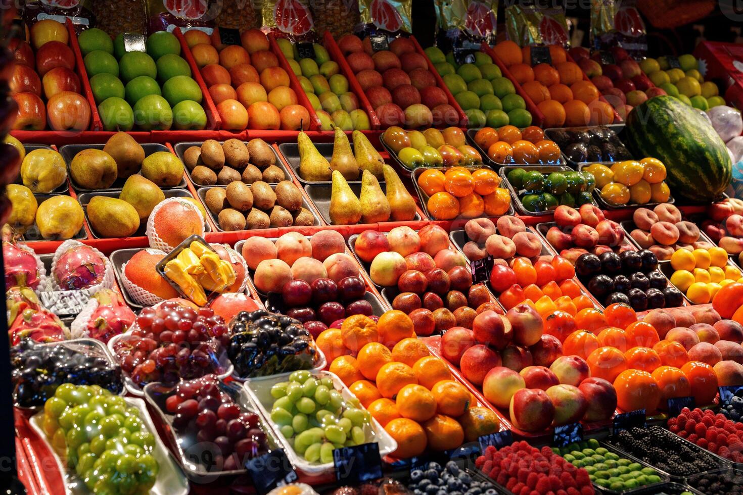 Colorful display of fresh fruits at a market during daytime in a vibrant community photo