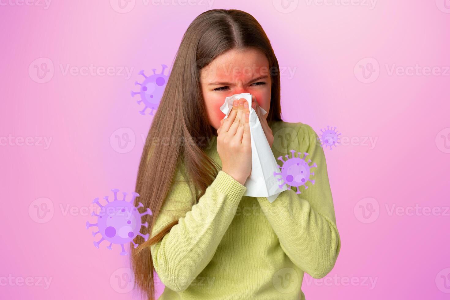 Young girl experiencing cold symptoms with a tissue against a colorful background photo
