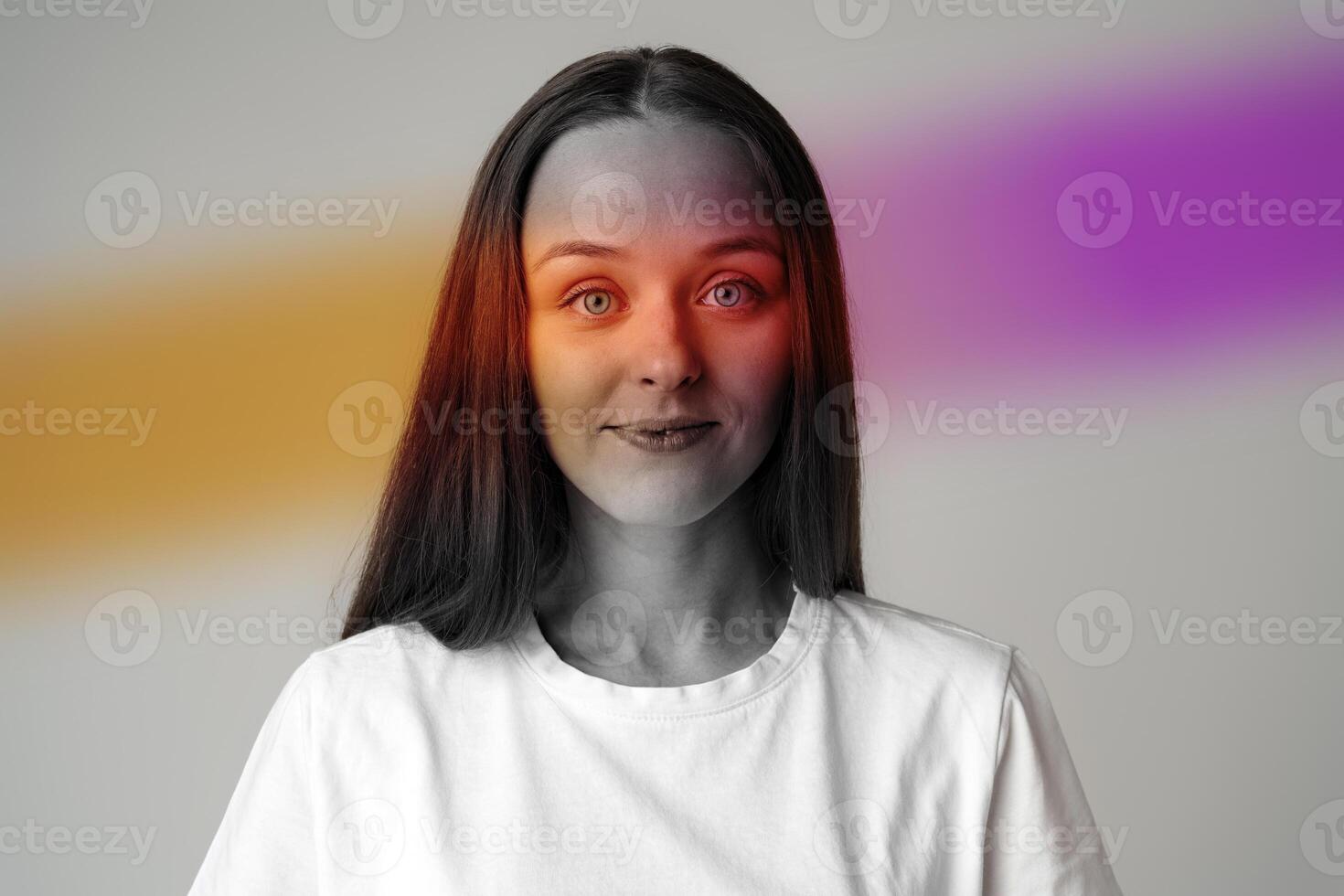 Portrait of a young woman with vibrant color accents in a minimalist studio setting, captured during afternoon light photo